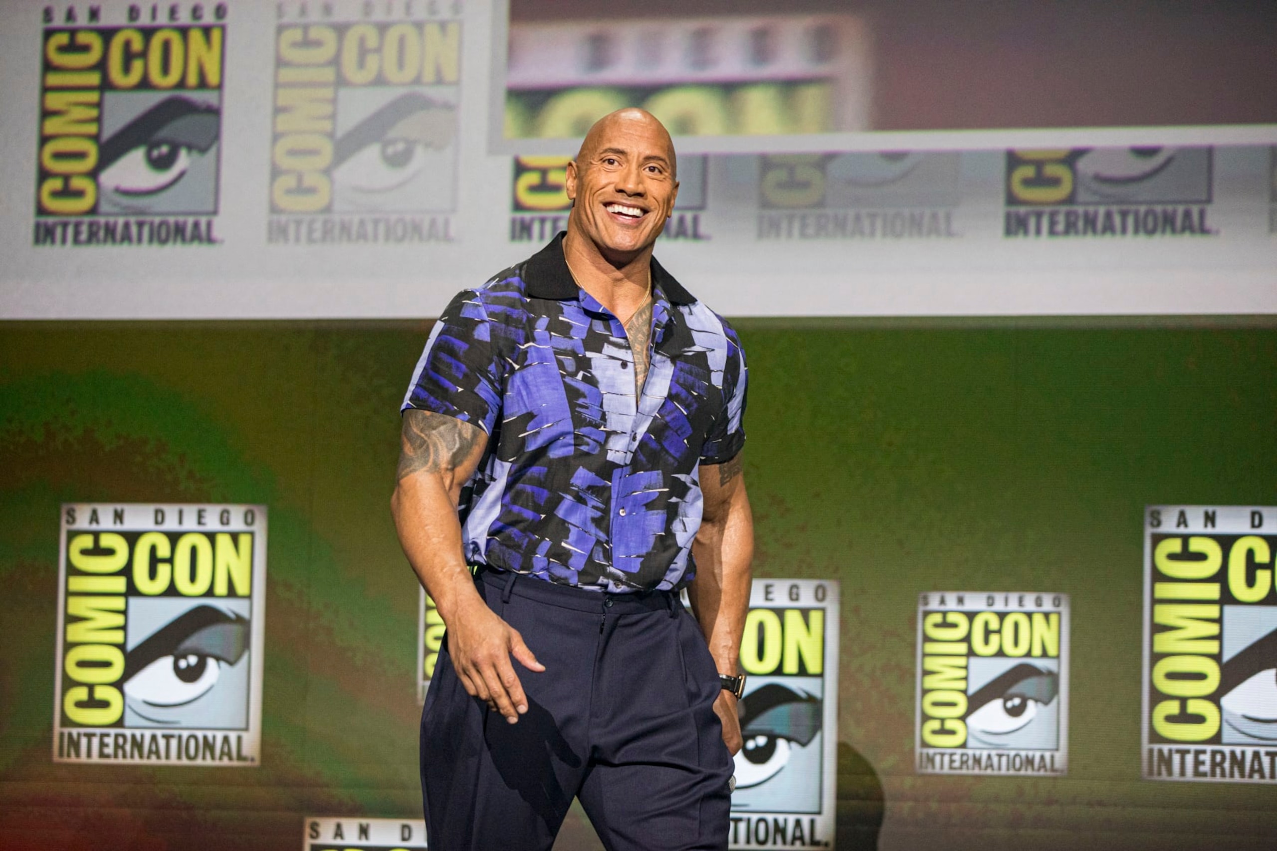 SAN DIEGO, CALIFORNIA - JULY 23: Actor Dwayne "The Rock" Johnson appears at the Warner Brothers panel promoting his upcoming film "Black Adam" at 2022 Comic-Con International Day 3 at San Diego Convention Center on July 23, 2022 in San Diego, California. (Photo by Daniel Knighton/Getty Images) SAN DIEGO, CALIFORNIA - JULY 23: Actor Dwayne "The Rock" Johnson appears at the Warner Brothers panel promoting his upcoming film "Black Adam" at 2022 Comic-Con International Day 3 at San Diego Convention Center on July 23, 2022 in San Diego, California. (Photo by Daniel Knighton/Getty Images)