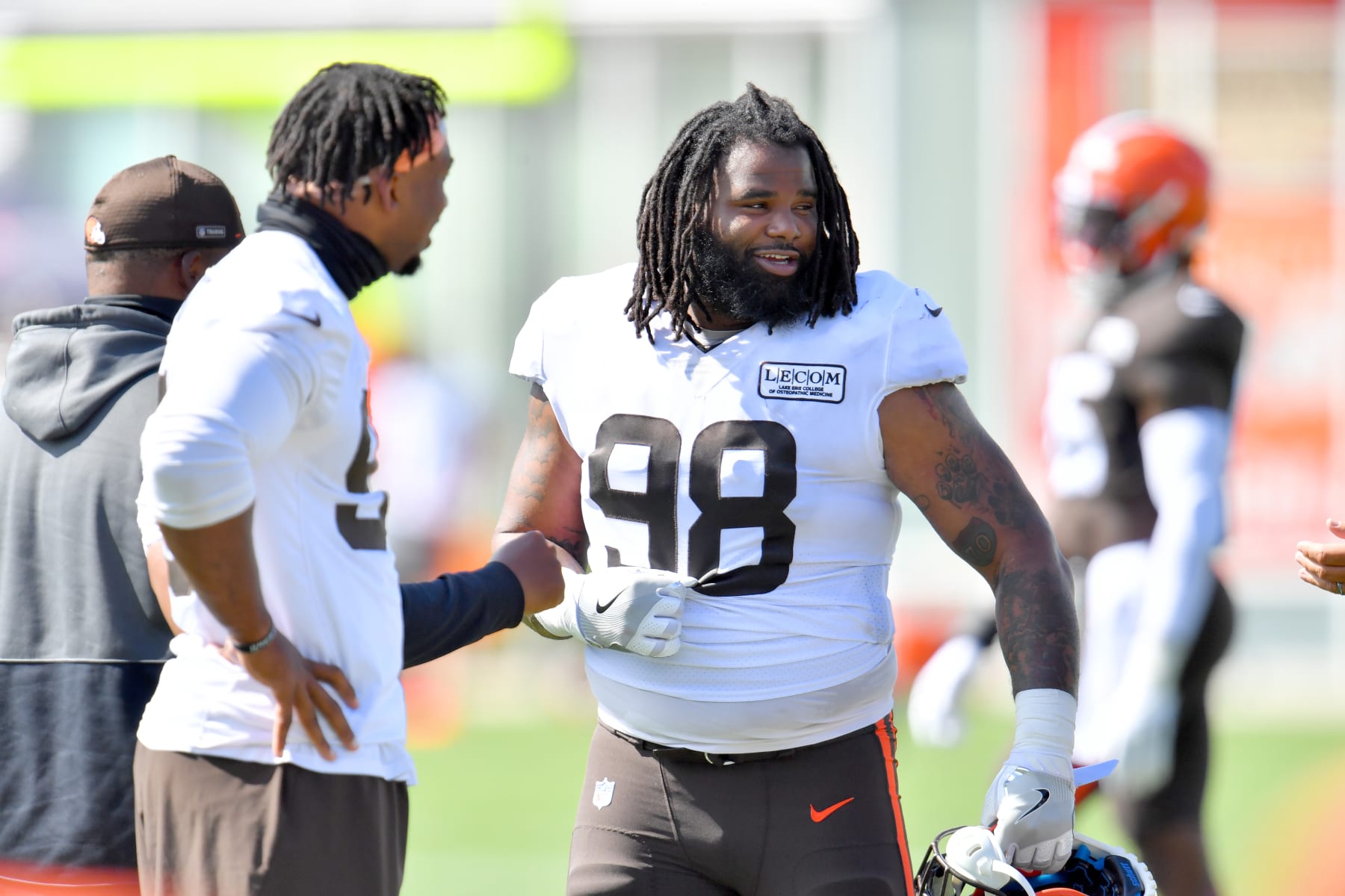 BEREA, OHIO - AUGUST 18: Defensive tackle Sheldon Richardson #98 of the Cleveland Browns talks with teammates during NFL training camp on August 18, 2020 at the Browns training facility in Berea, Ohio. (Photo by Jason Miller/Getty Images)