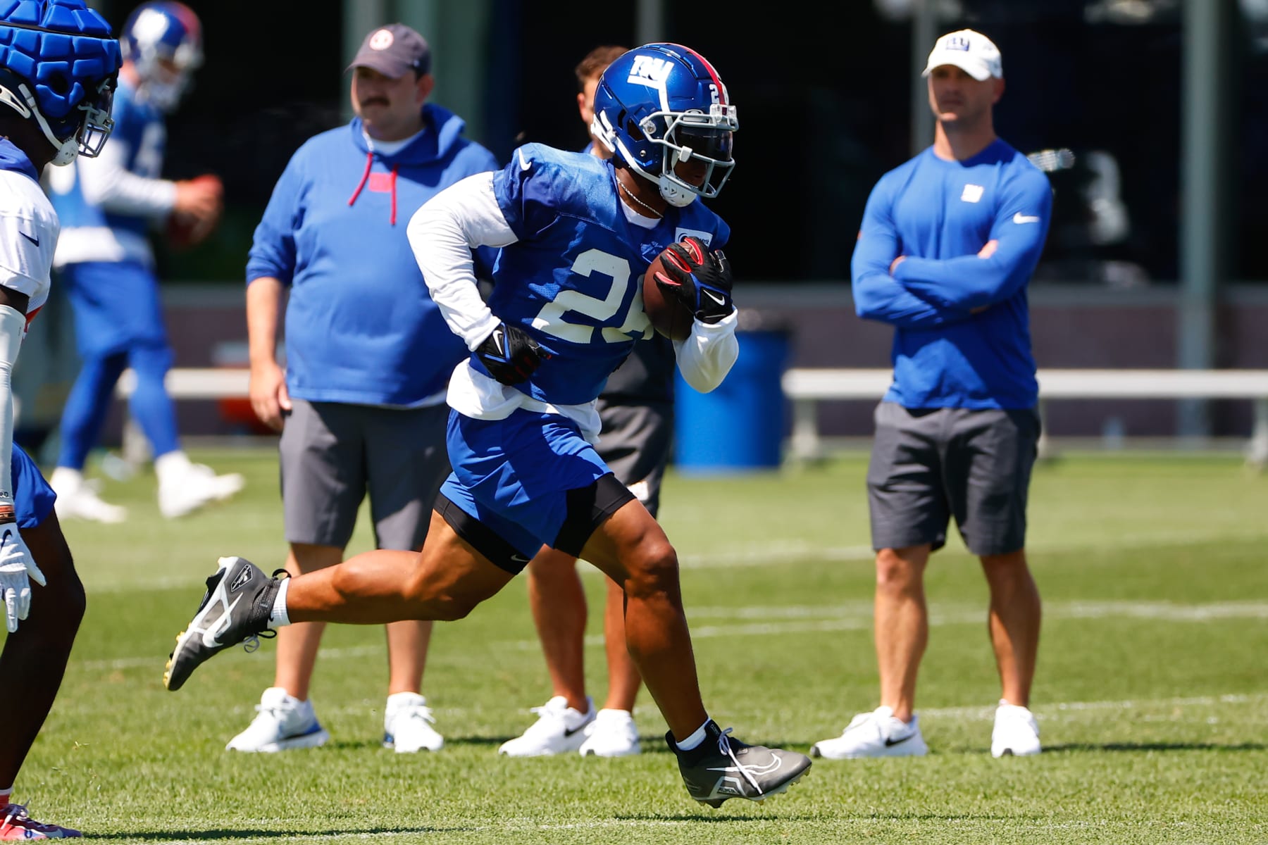 EAST RUTHERFORD, NJ - JULY 30:  Saquon Barkley  (26) New York Giants running back runs with the football during training camp on July 30, 2022 at Quest Diagnostics Training Center in East Rutherford, New Jersey.  (Photo by Rich Graessle/Icon Sportswire via Getty Images)