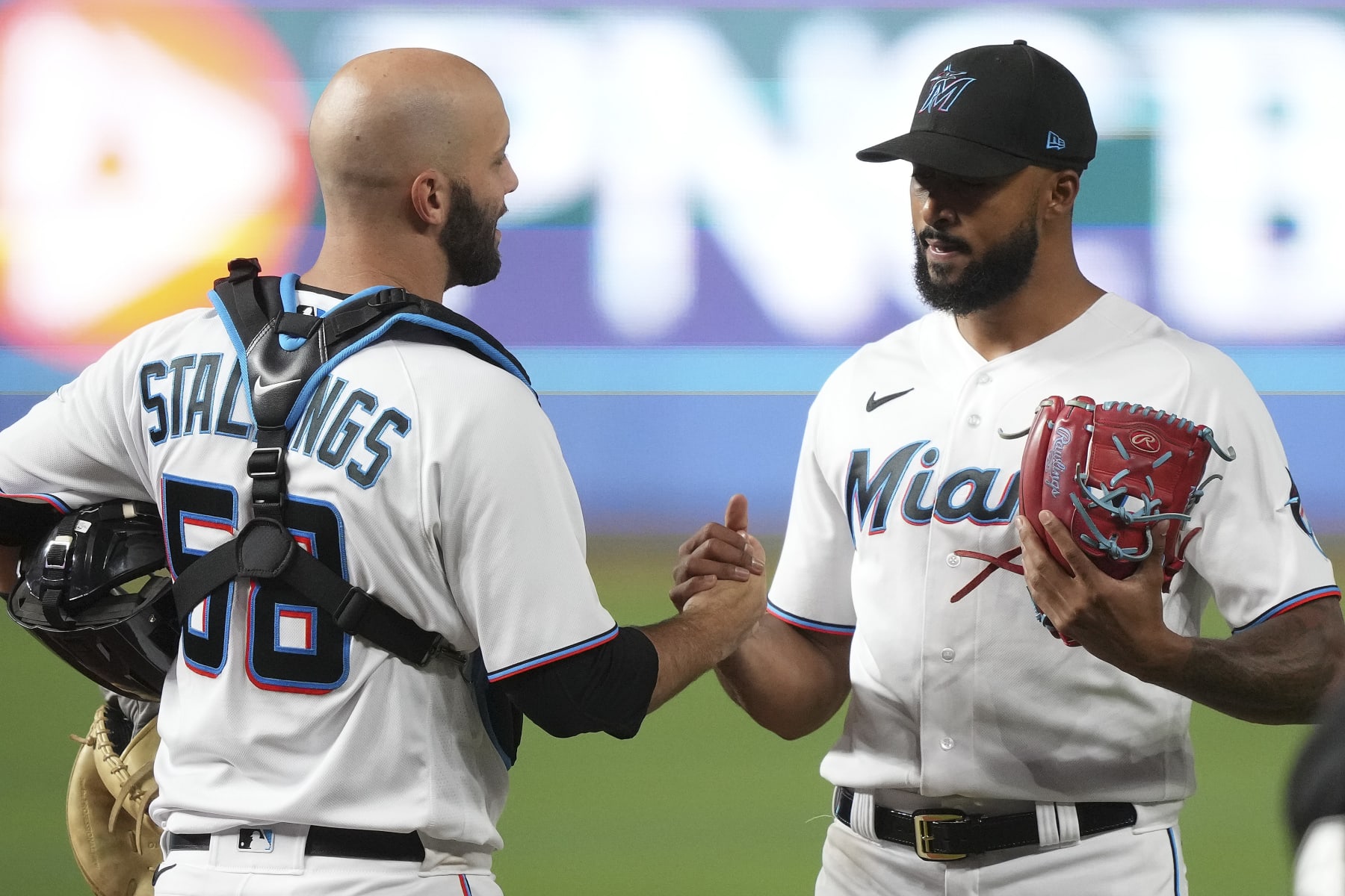 MIAMI, FLORIDA - AUGUST 03: Sandy Alcantara #22 of the Miami Marlins is congratulated by catcher Jacob Stallings #58 after throwing a complete game shutout against the Cincinnati Reds at loanDepot park on August 03, 2022 in Miami, Florida. (Photo by Eric Espada/Getty Images)