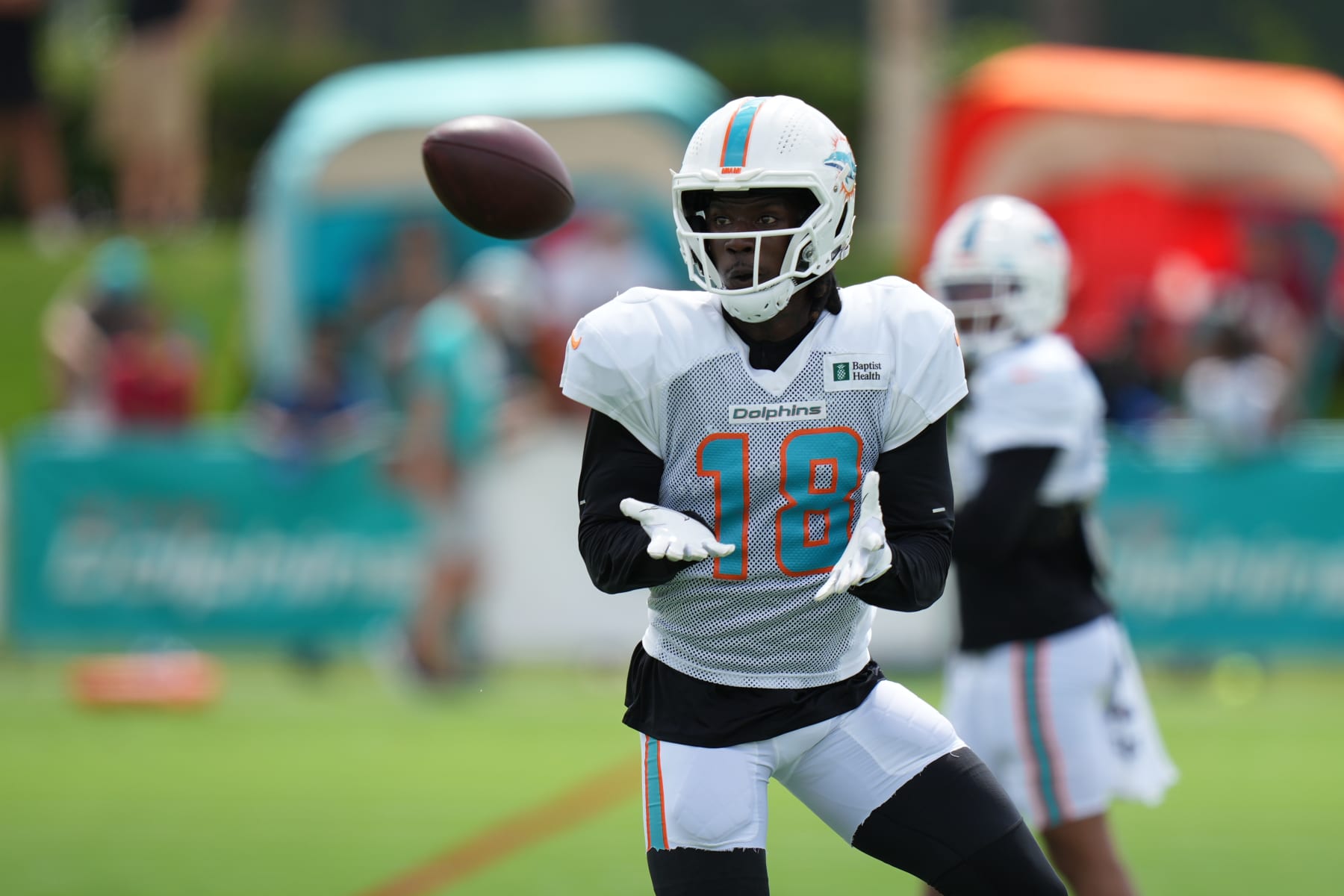 MIAMI GARDENS, FL - AUG 2: Miami Dolphins receiver Preston Williams (18) eyes an incoming pass during the Miami Dolphins training camp on Tuesday, August 2, 2022 at Baptist Health Training Center in Miami Gardens, FL (Photo by Peter Joneleit/Icon Sportswire via Getty Images)
