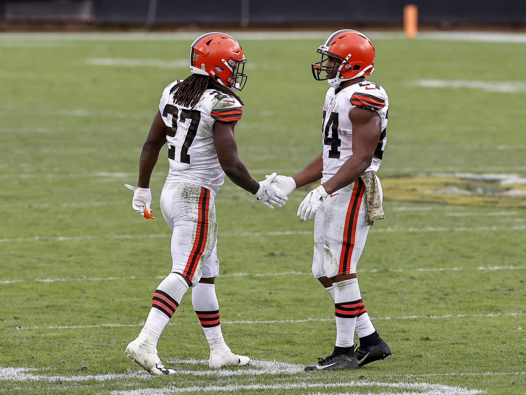 JACKSONVILLE, FL - NOVEMBER 29: Runningbacks Kareem Hunt #27 and Nick Chubb #24 of the Cleveland Browns shake hands after the game against the Jacksonville Jaguars at TIAA Bank Field on November 29, 2020 in Jacksonville, Florida. The Browns defeated the Jaguars 27-25. (Photo by Don Juan Moore/Getty Images)