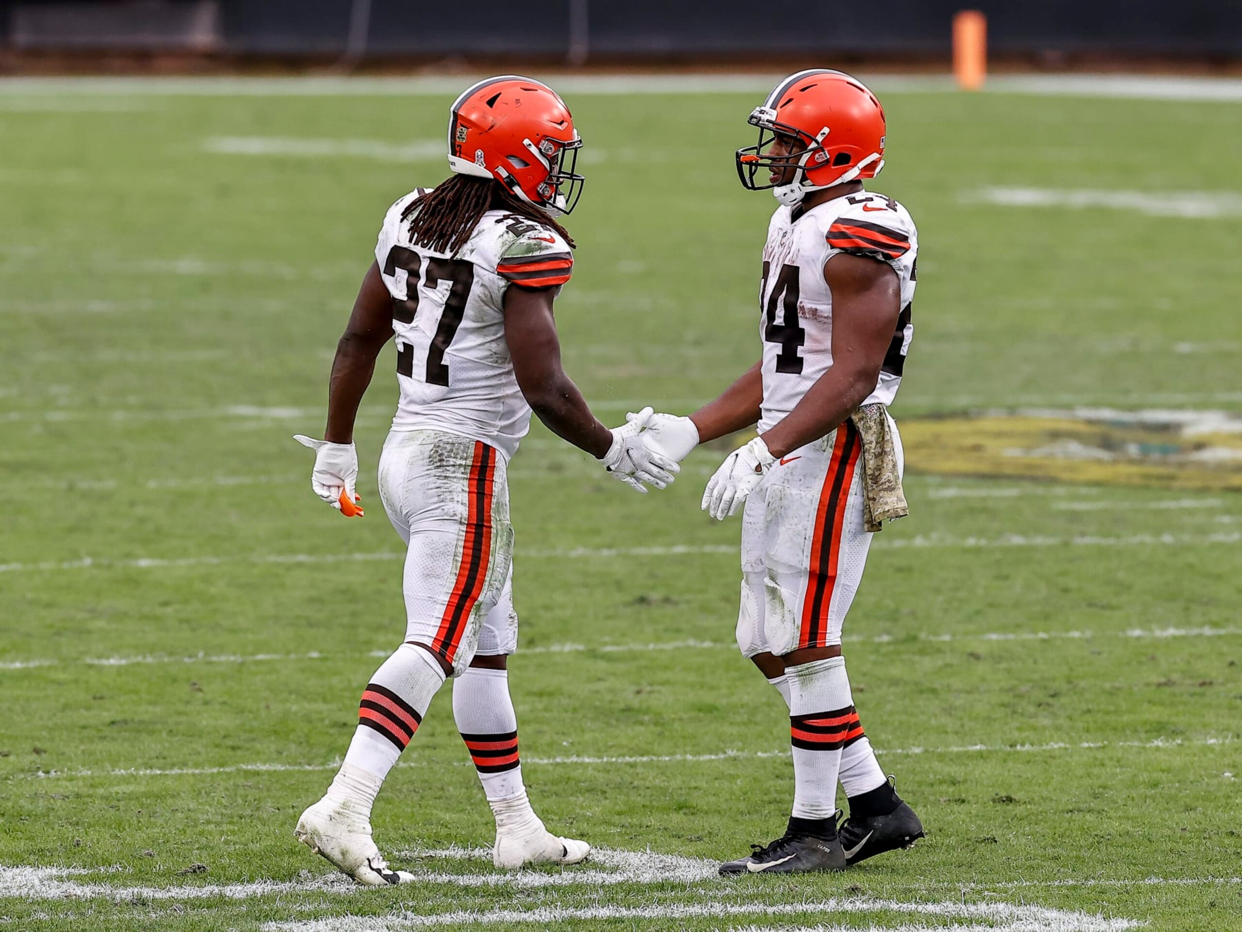 JACKSONVILLE, FL - NOVEMBER 29: Runningbacks Kareem Hunt #27 and Nick Chubb #24 of the Cleveland Browns shake hands after the game against the Jacksonville Jaguars at TIAA Bank Field on November 29, 2020 in Jacksonville, Florida. The Browns defeated the Jaguars 27-25. (Photo by Don Juan Moore/Getty Images)