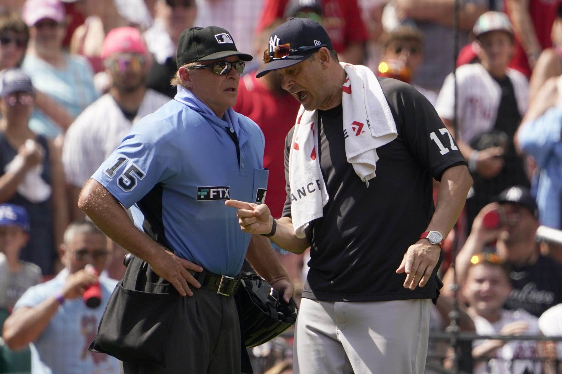 New York Yankees manager Aaron Boone, right, argues with home plate umpire Ed Hickox after being ejected during the fifth inning of a baseball game against the St. Louis Cardinals Sunday, Aug. 7, 2022, in St. Louis. (AP Photo/Jeff Roberson)