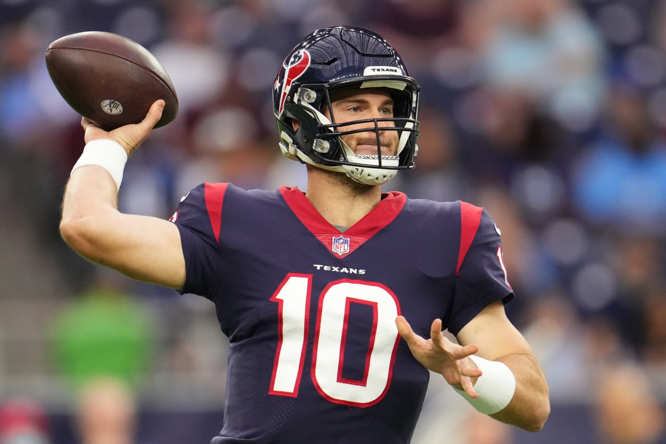 HOUSTON, TEXAS - JANUARY 09: Davis Mills #10 of the Houston Texans throws the ball against the Tennessee Titans during an NFL game at NRG Stadium on January 09, 2022 in Houston, Texas. (Photo by Cooper Neill/Getty Images)