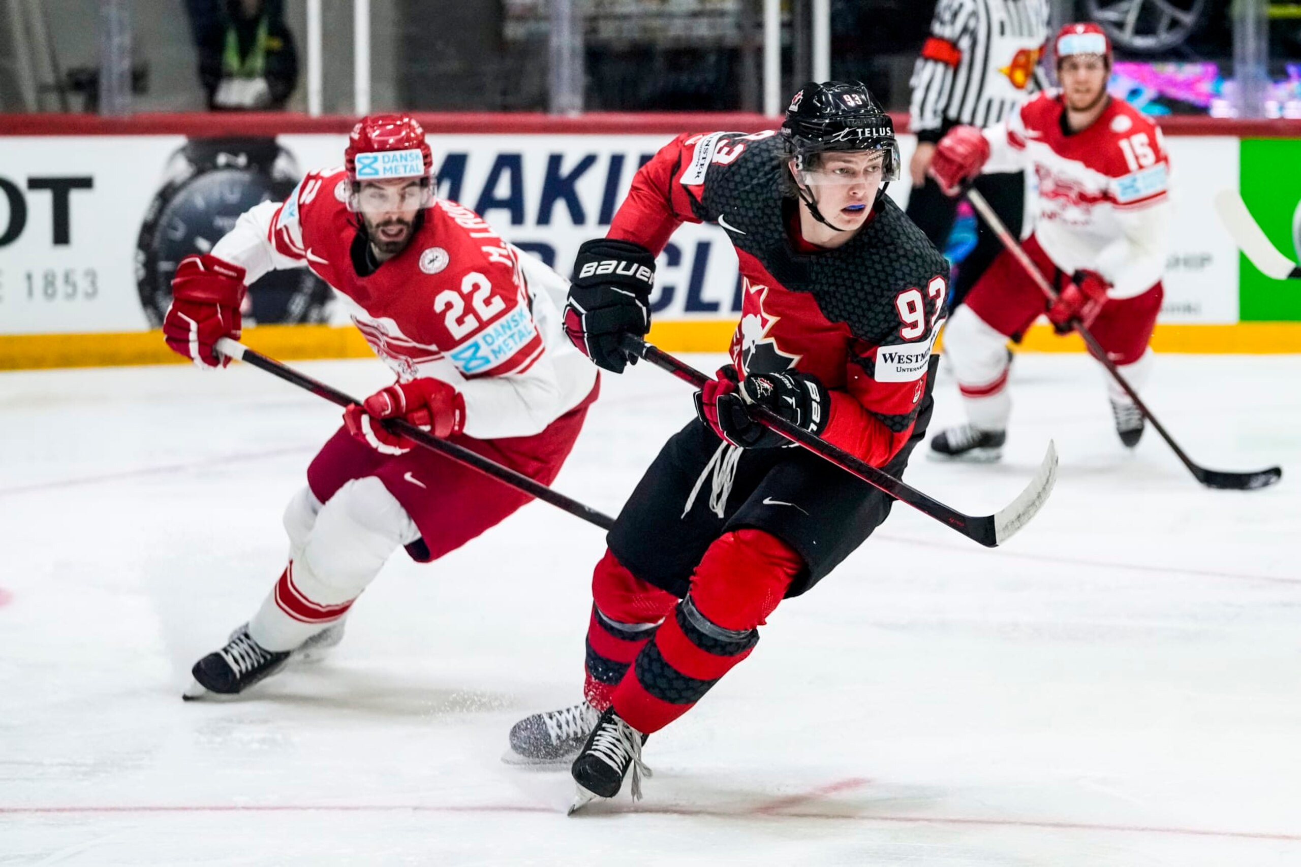 HELSINKI, FINLAND - MAY 23: Markus Lauridsen of Denmark (L) against Kent Johnson of Canada (R) during the 2022 IIHF Ice Hockey World Championship match between Canada and Denmark at Helsinki Ice Hall on May 23, 2022 in Helsinki, Finland. (Photo by Jari Pestelacci/Eurasia Sport Images/Getty Images)