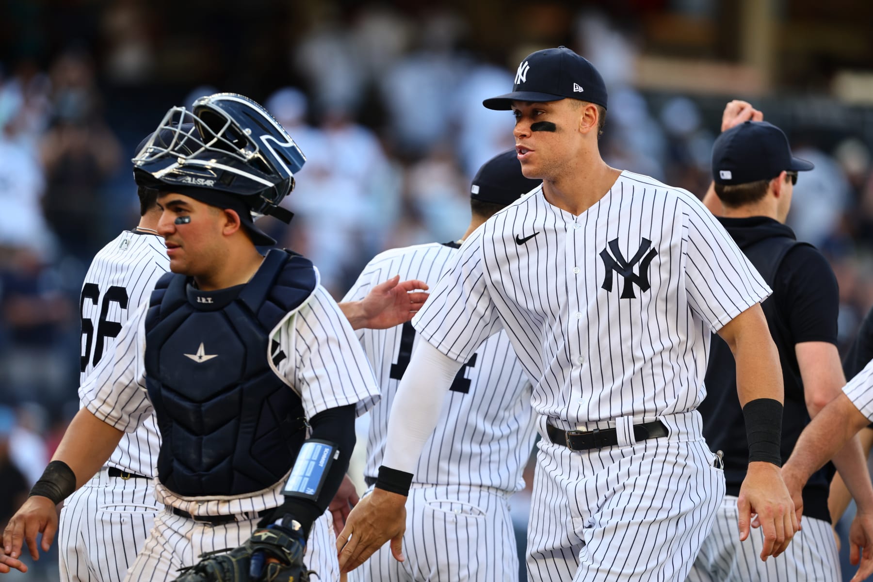NEW YORK, NY - JULY 30: Aaron Judge #99 of the New York Yankees is congratulated by teammates after defeating the Kansas City Royals 8-2 in a a game at Yankee Stadium on July 30, 2022 in New York City. (Photo by Rich Schultz/Getty Images)