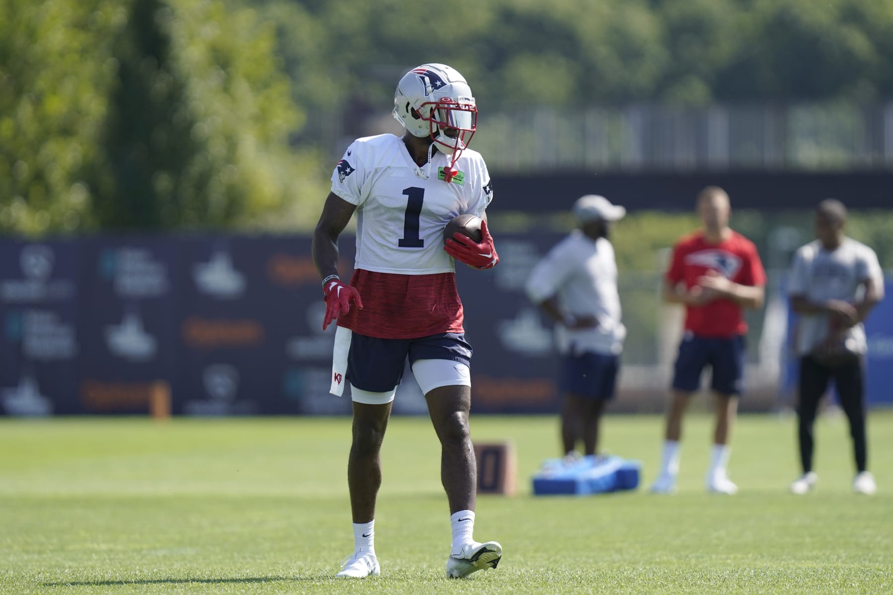 New England Patriots wide receiver DeVante Parker (1) carries the ball during an NFL football team training camp, Wednesday, Aug. 3, 2022, in Foxborough, Mass. (AP Photo/Steven Senne)