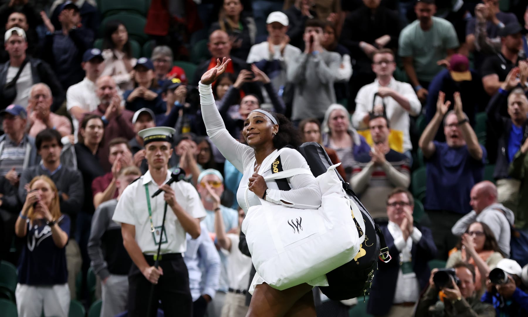 LONDON, ENGLAND - JUNE 28: Serena Williams of The United States waves to the crowd after losing against Harmony Tan of France during their Women's Singles First Round Match on day two of The Championships Wimbledon 2022 at All England Lawn Tennis and Croquet Club on June 28, 2022 in London, England. (Photo by Clive Brunskill/Getty Images)