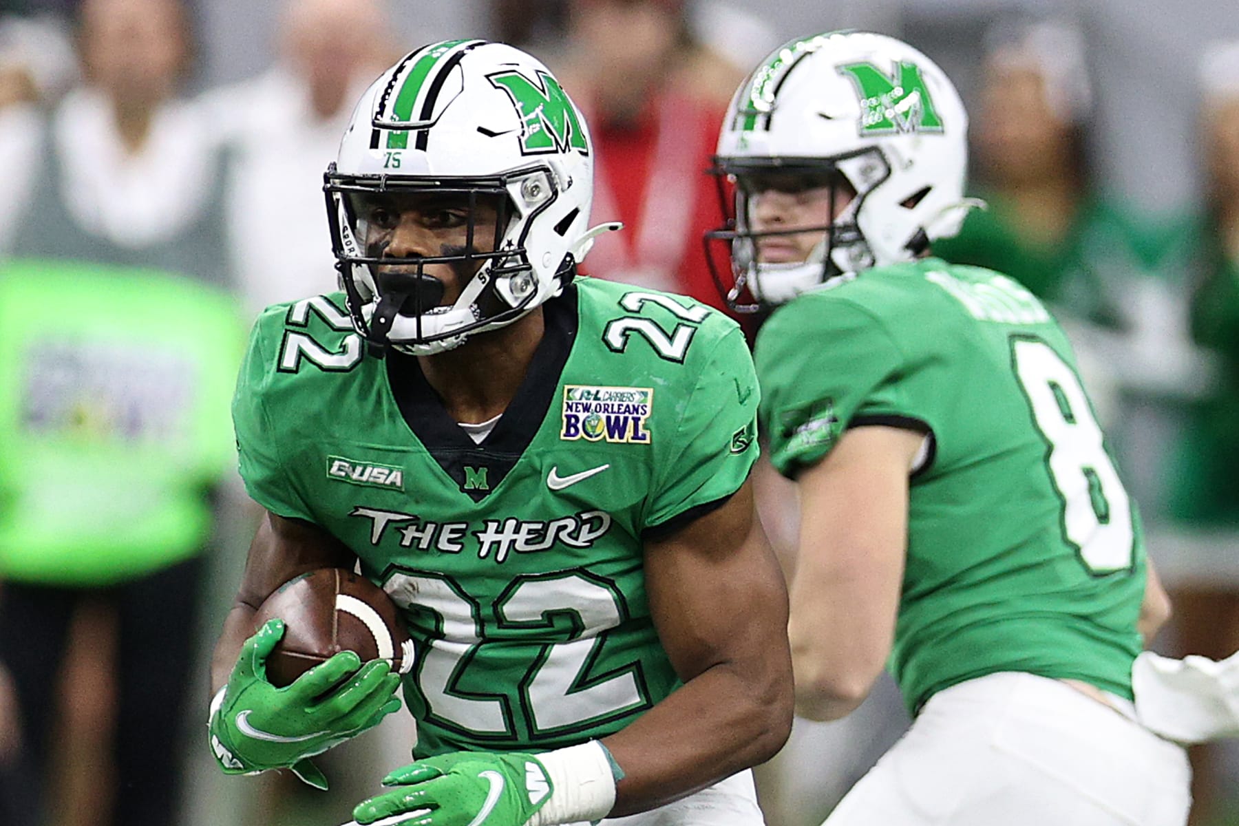 NEW ORLEANS, LOUISIANA - DECEMBER 18: Rasheen Ali #22 of the Marshall Thundering Herd runs with the ball against the Louisiana-Lafayette Ragin Cajuns during the R+L Carriers New Orleans Bowl at Caesars Superdome on December 18, 2021 in New Orleans, Louisiana. (Photo by Chris Graythen/Getty Images)