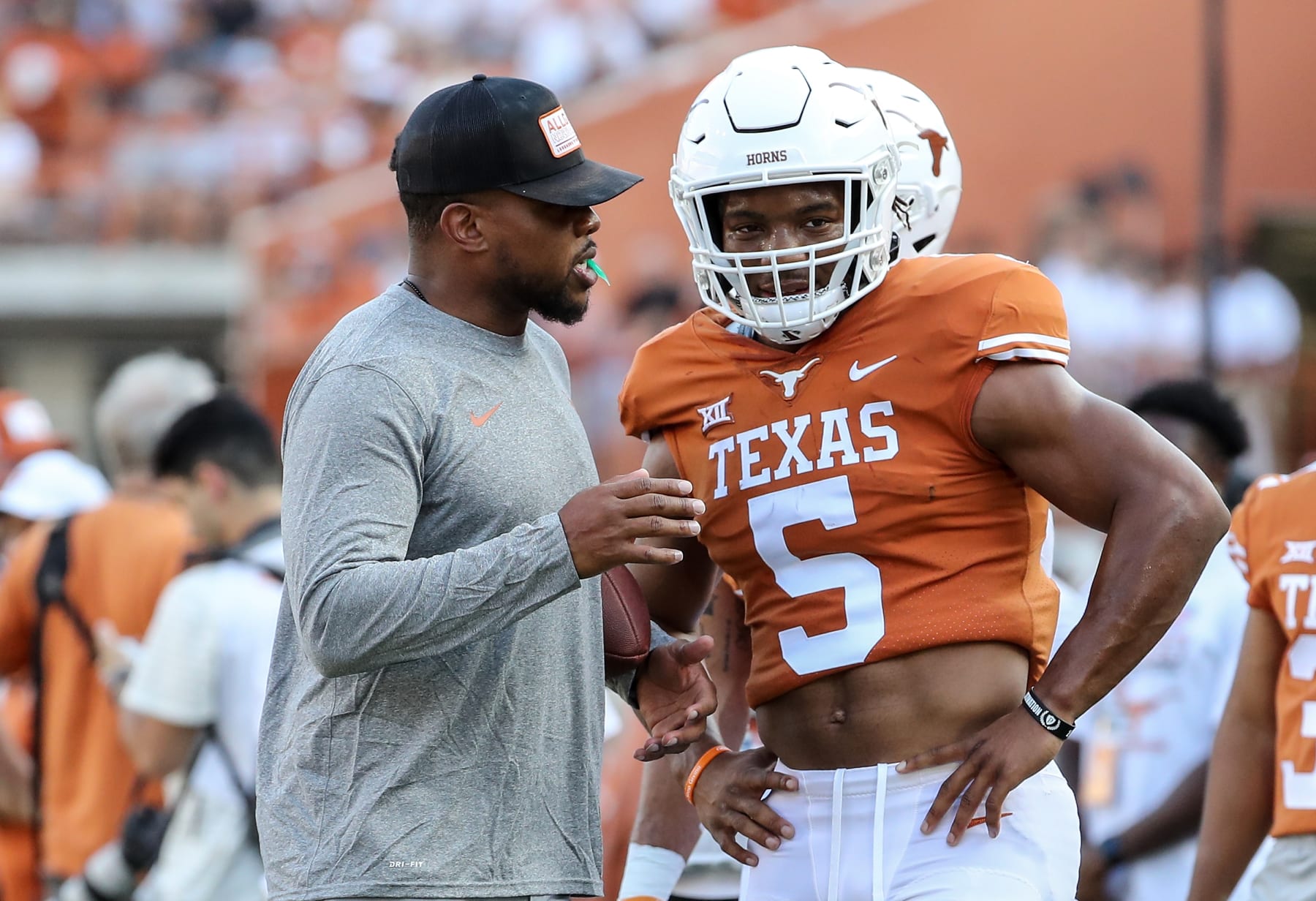 AUSTIN, TEXAS - APRIL 23: Running backs coach Tashard Choice of the Texas Longhorns talks with Bijan Robinson #5 during the Orange-White Spring Game at Darrell K Royal-Texas Memorial Stadium on April 23, 2022 in Austin, Texas. (Photo by Tim Warner/Getty Images)