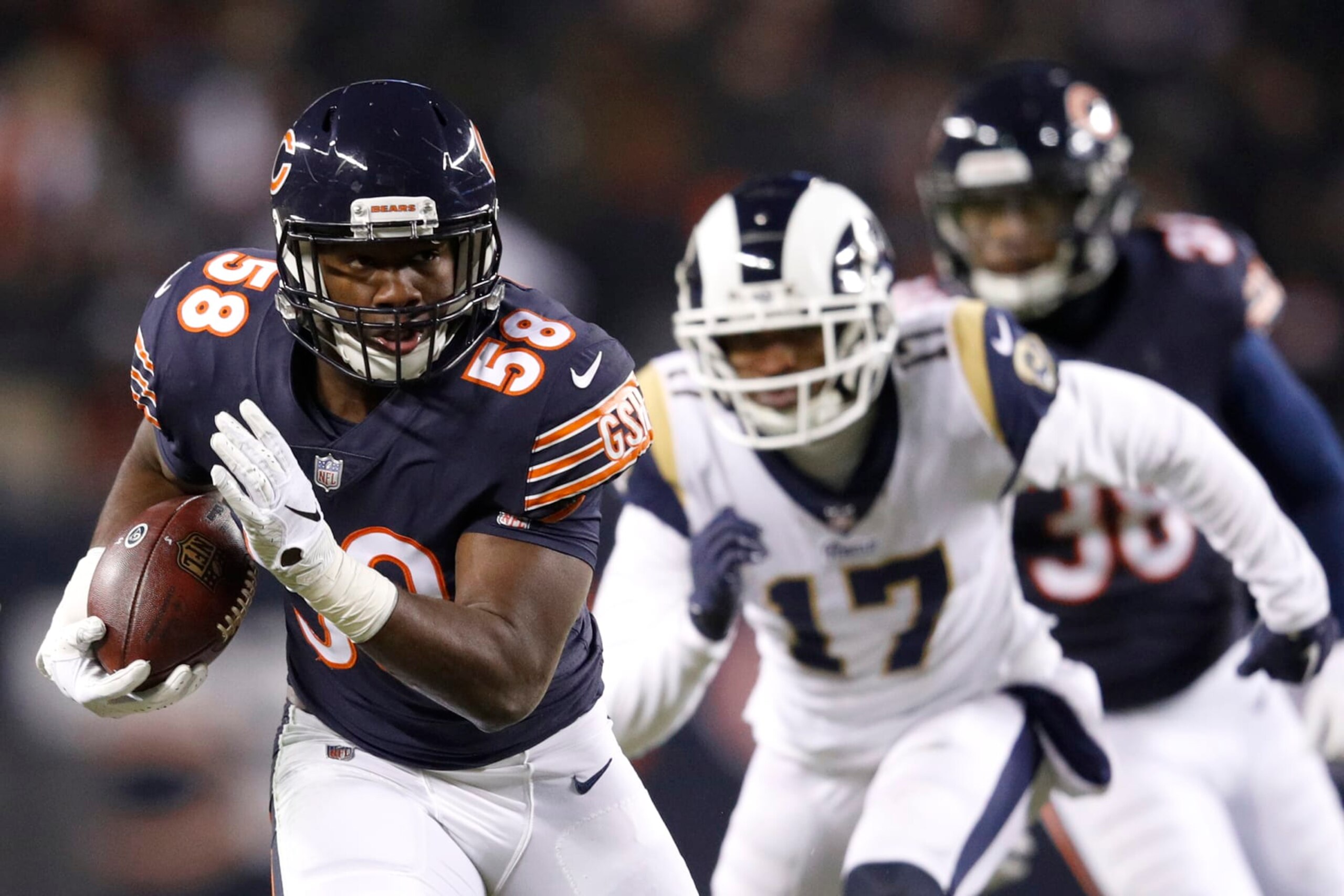 CHICAGO, IL - DECEMBER 09:  Roquan Smith #58 of the Chicago Bears returns an interception in the second quarter against the Los Angeles Rams at Soldier Field on December 9, 2018 in Chicago, Illinois.  (Photo by Joe Robbins/Getty Images)
