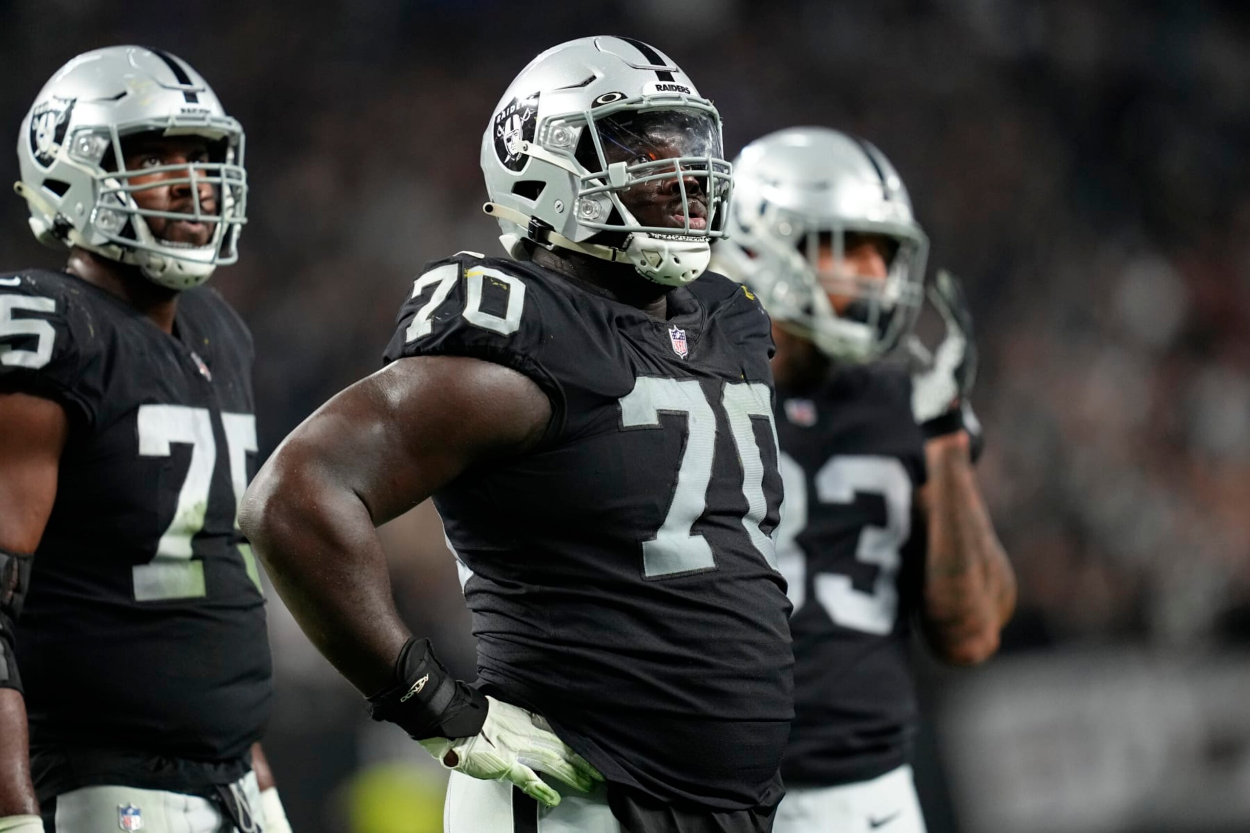 Las Vegas Raiders guard Alex Leatherwood (70) is seen on the sideline during the second half of an NFL football game against the Los Angeles Chargers, Sunday, Jan. 9, 2022, in Las Vegas. (AP Photo/Jeff Bottari)