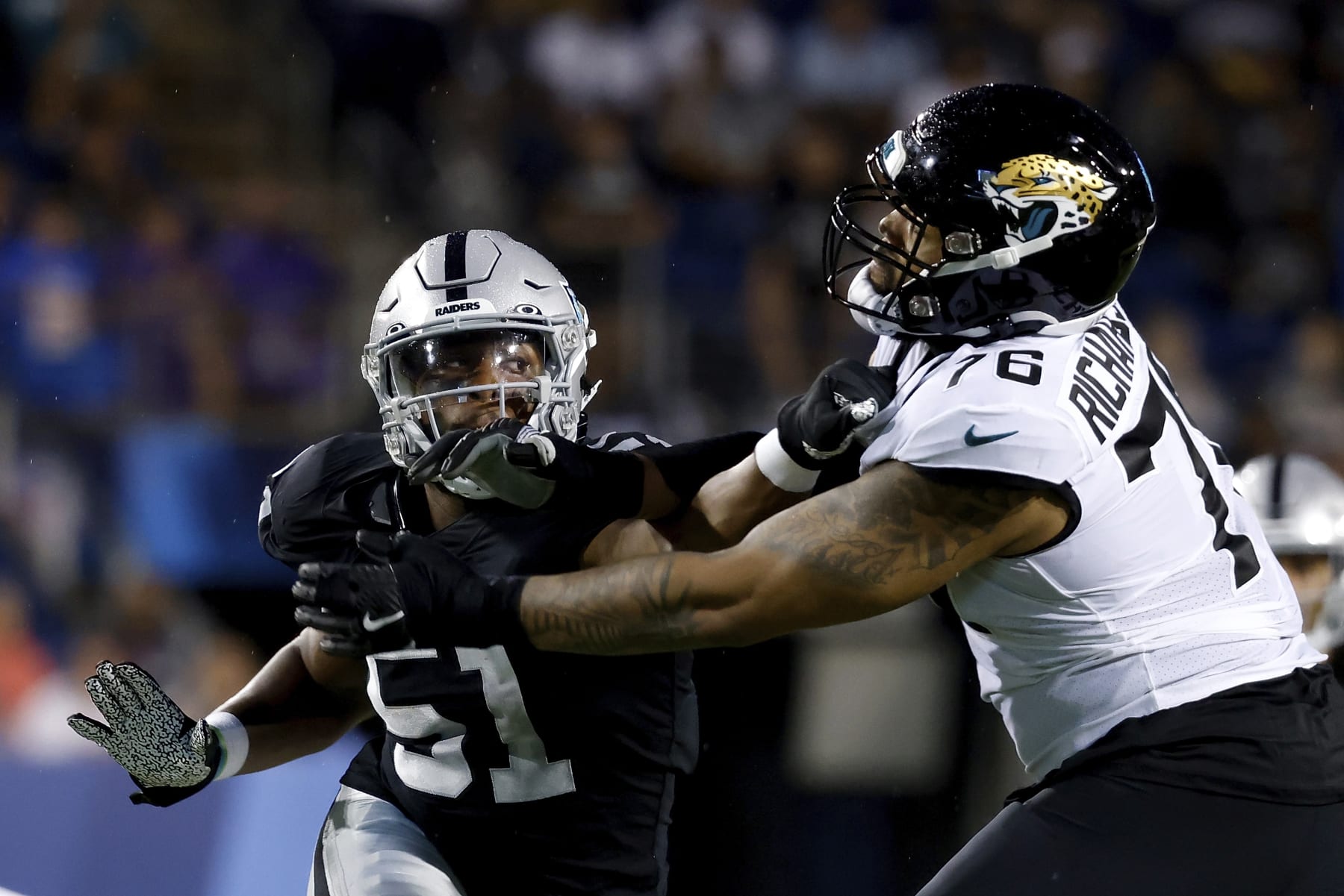Jacksonville Jaguars offensive tackle Will Richardson Jr. (76) attempts to block Las Vegas Raiders defensive end Malcolm Koonce (51) during an NFL preseason football game, Thursday, Aug. 4, 2022, in Canton, Ohio. (AP Photo/Kirk Irwin) Jacksonville Jaguars offensive tackle Will Richardson Jr. (76) attempts to block Las Vegas Raiders defensive end Malcolm Koonce (51) during an NFL preseason football game, Thursday, Aug. 4, 2022, in Canton, Ohio. (AP Photo/Kirk Irwin)