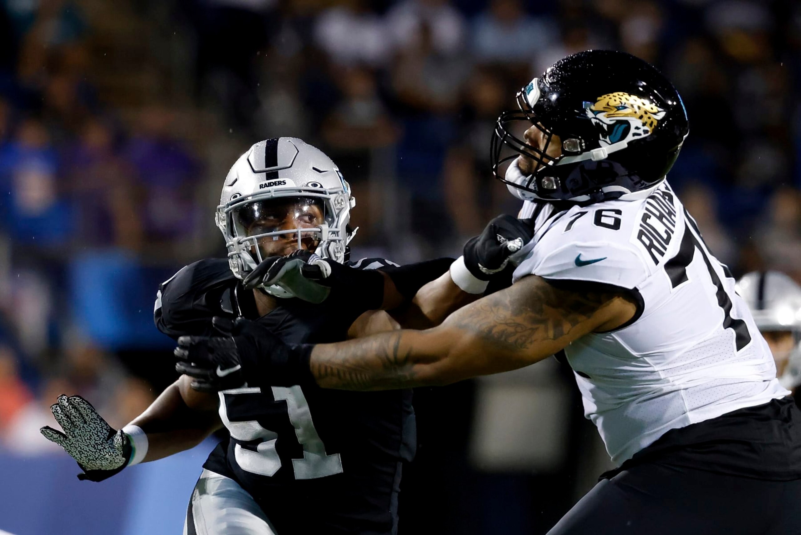 Jacksonville Jaguars offensive tackle Will Richardson Jr. (76) attempts to block Las Vegas Raiders defensive end Malcolm Koonce (51) during an NFL preseason football game, Thursday, Aug. 4, 2022, in Canton, Ohio. (AP Photo/Kirk Irwin)