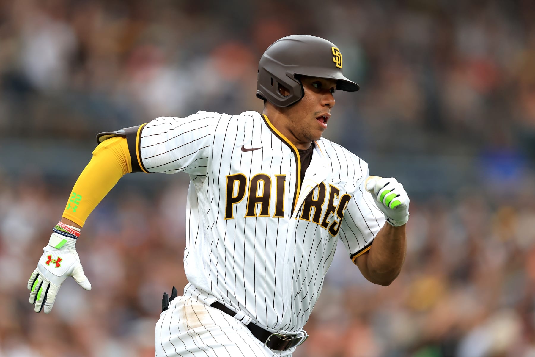SAN DIEGO, CALIFORNIA - AUGUST 08: Juan Soto #22 of the San Diego Padres runs to first base after hitting a single during the first inning of a game against the San Francisco Giants at PETCO Park on August 08, 2022 in San Diego, California. (Photo by Sean M. Haffey/Getty Images)
