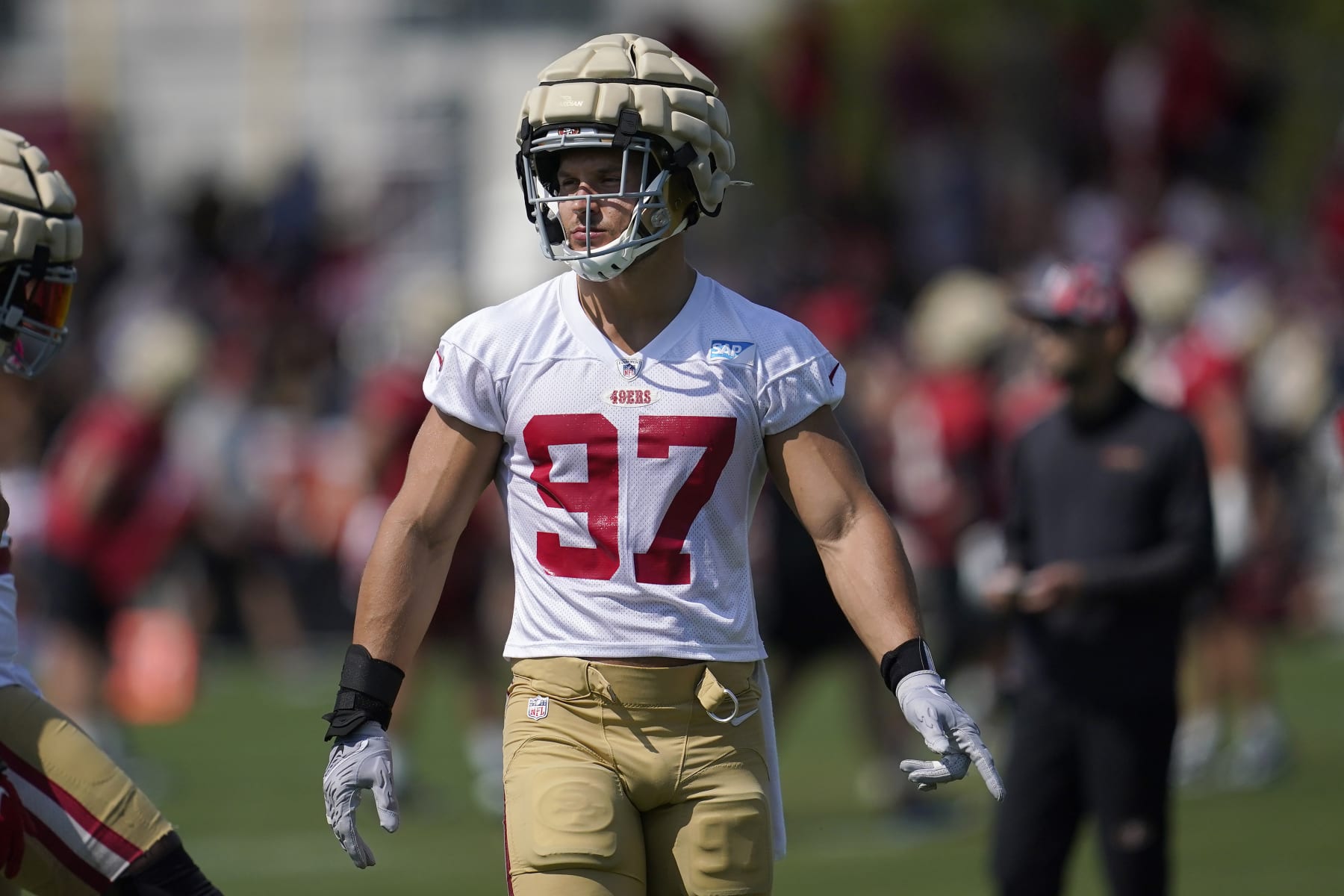 San Francisco 49ers defensive end Nick Bosa (97) takes part in drills at the NFL football team's practice facility in Santa Clara, Calif., Saturday, July 30, 2022. (AP Photo/Jeff Chiu) San Francisco 49ers defensive end Nick Bosa (97) takes part in drills at the NFL football team's practice facility in Santa Clara, Calif., Saturday, July 30, 2022. (AP Photo/Jeff Chiu)
