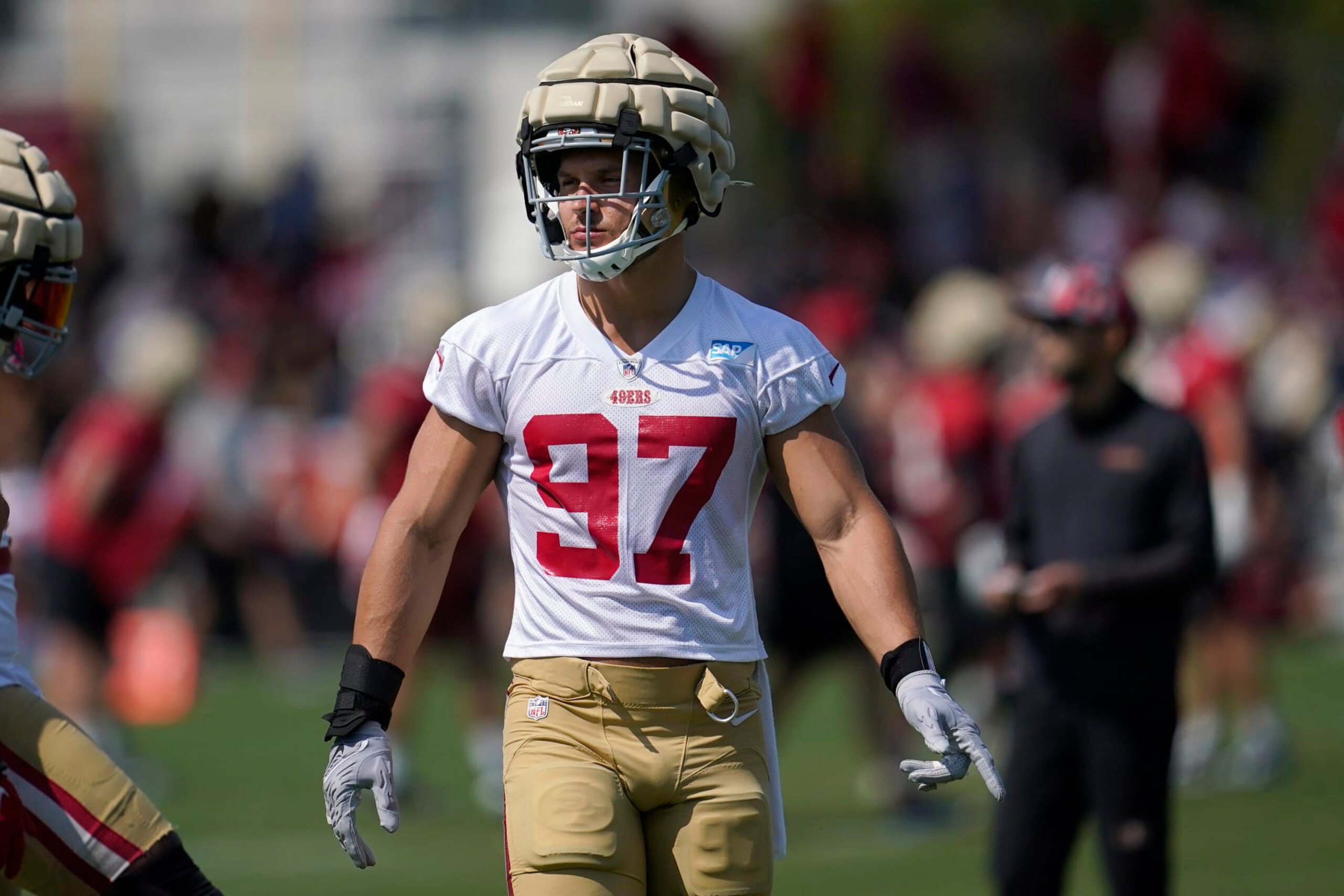 San Francisco 49ers defensive end Nick Bosa (97) takes part in drills at the NFL football team's practice facility in Santa Clara, Calif., Saturday, July 30, 2022. (AP Photo/Jeff Chiu)
