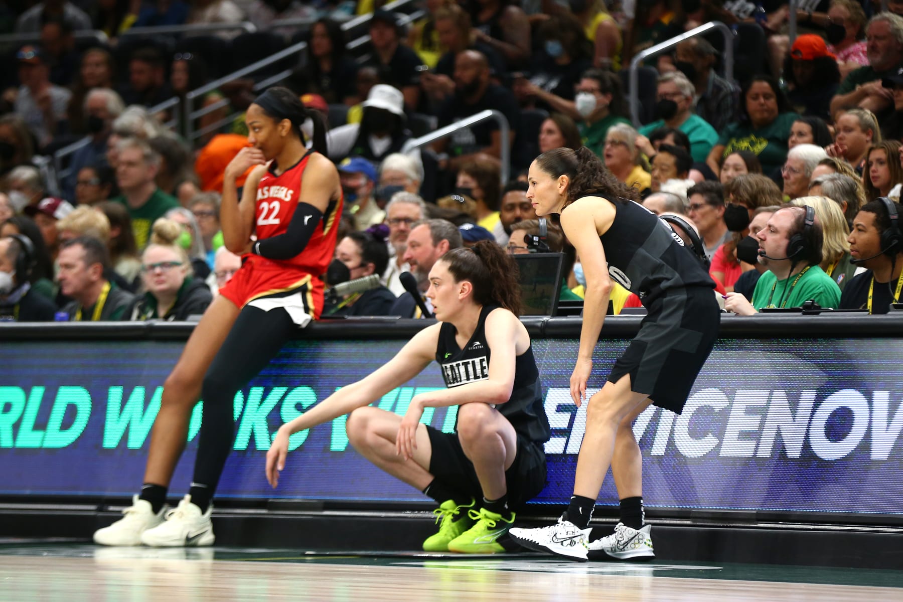 SEATTLE, WA - AUGUST 7: A'ja Wilson #22 of the Las Vegas Aces, Breanna Stewart #30 and Sue Bird #10 of the Seattle Storm look on during the game on August 7, 2022 at the Climate Pledge Arena in Seattle, Washington. NOTE TO USER: User expressly acknowledges and agrees that, by downloading and or using this photograph, User is consenting to the terms and conditions of the Getty Images License Agreement. Mandatory Copyright Notice: Copyright 2022 NBAE (Photo by Lindsey Wasson/NBAE via Getty Images)