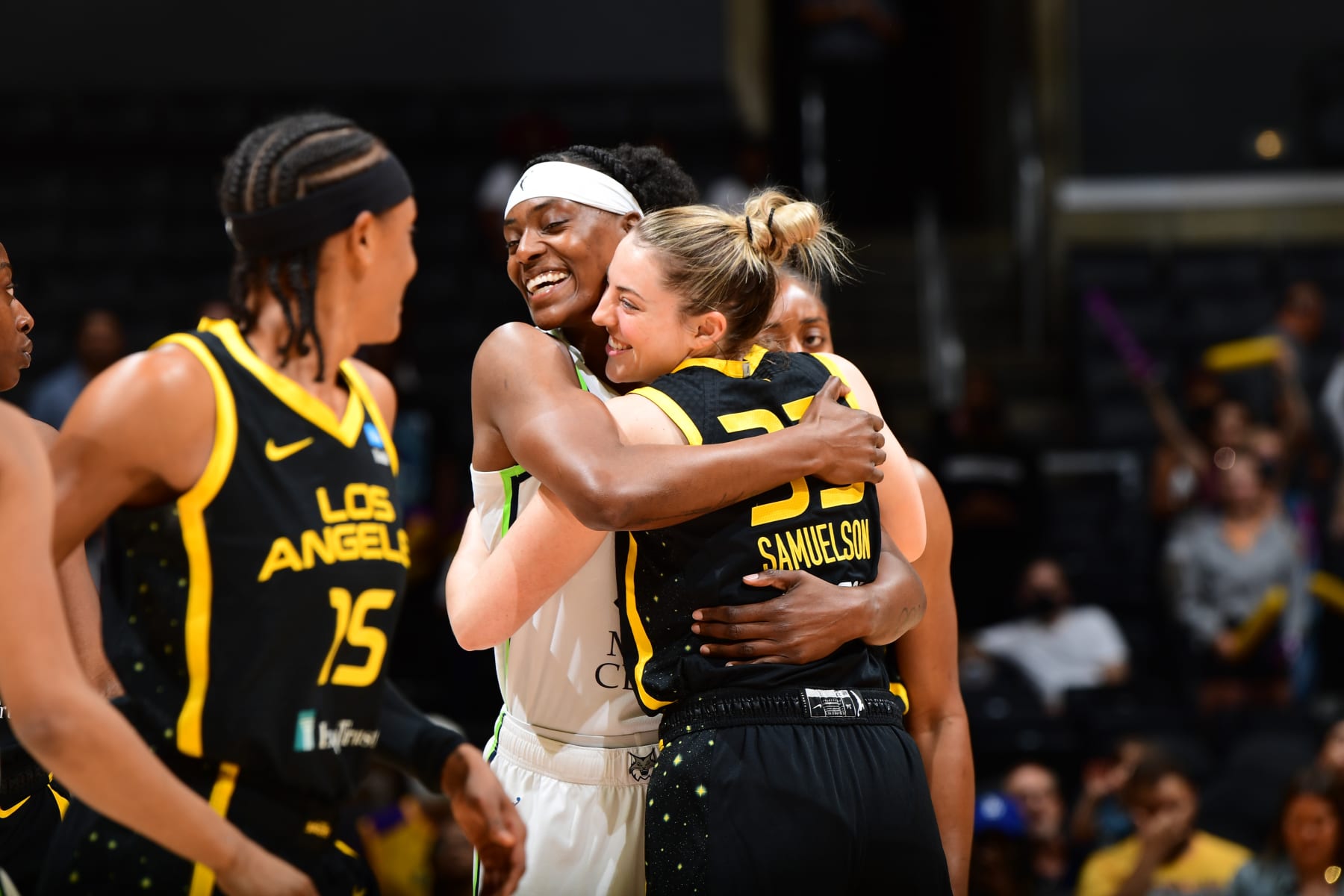 LOS ANGELES, CA - JULY 31: Sylvia Fowles #34 of the Minnesota Lynx and Katie Lou Samuelson #33 of the Los Angeles Sparks hug before the game on July 31, 2022 at Crypto.com Arena in Los Angeles, California. NOTE TO USER: User expressly acknowledges and agrees that, by downloading and/or using this Photograph, user is consenting to the terms and conditions of the Getty Images License Agreement. Mandatory Copyright Notice: Copyright 2022 NBAE (Photo by Adam Pantozzi/NBAE via Getty Images)