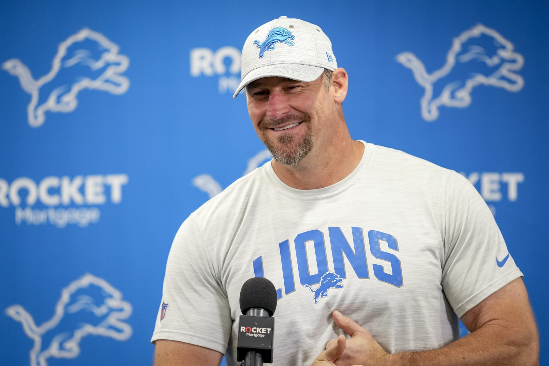ALLEN PARK, MICHIGAN - JULY 29: Head coach Dan Campbell of the Detroit Lions smile while answering questions from reporters during the Detroit Lions Training Camp at the Lions Headquarters and Training Facility on July 29, 2022 in Allen Park, Michigan. (Photo by Nic Antaya/Getty Images)