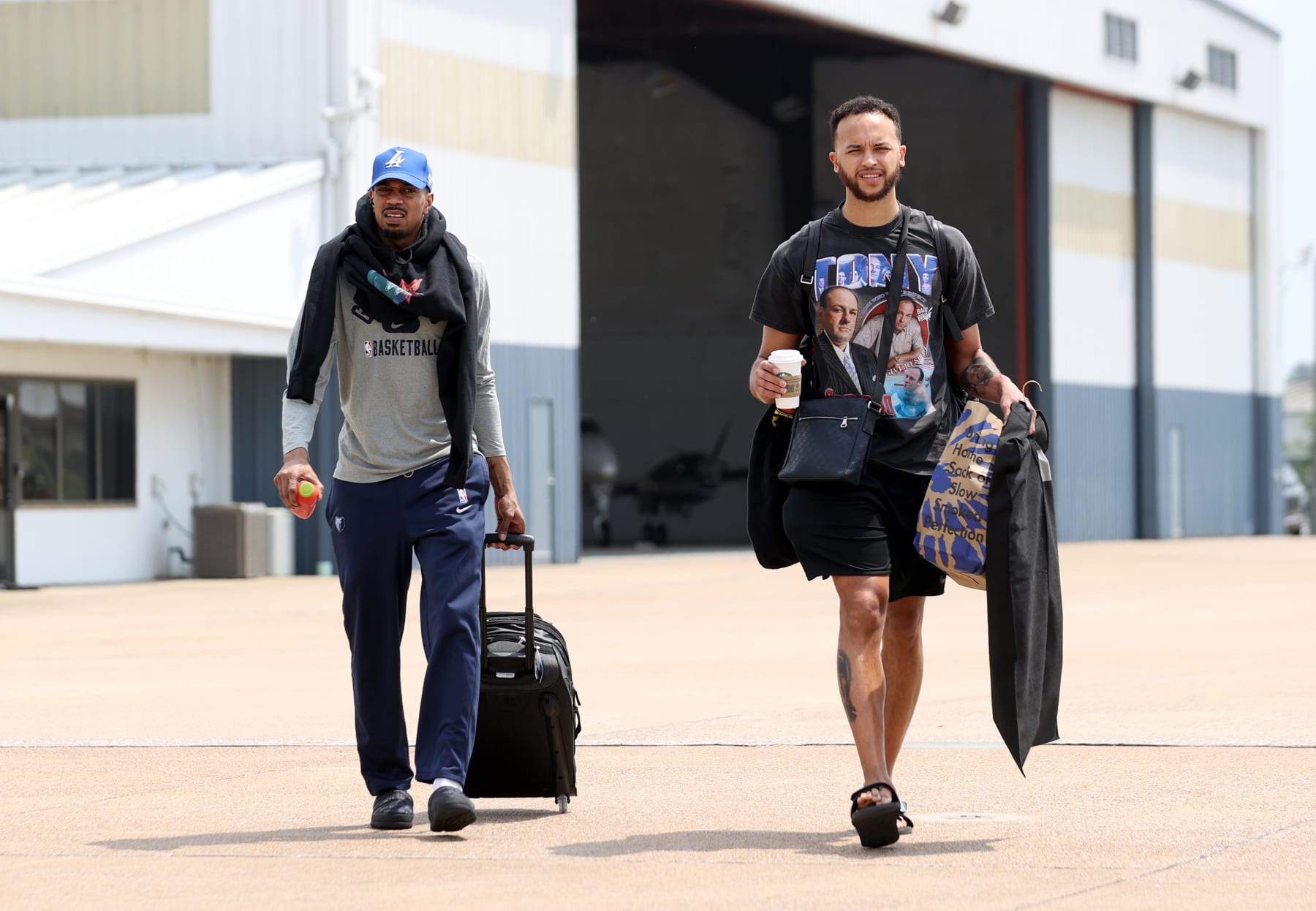 MEMPHIS, TN - MAY 12: De'Anthony Melton #0 and Kyle Anderson #1 of the Memphis Grizzlies board the team charter on May 12, 2022 at Wilson Air Center in Memphis, Tennessee.  NOTE TO USER: User expressly acknowledges and agrees that, by downloading and or using this photograph, User is consenting to the terms and conditions of the Getty Images License Agreement. Mandatory Copyright Notice: Copyright 2022 NBAE (Photo by Joe Murphy/NBAE via Getty Images)