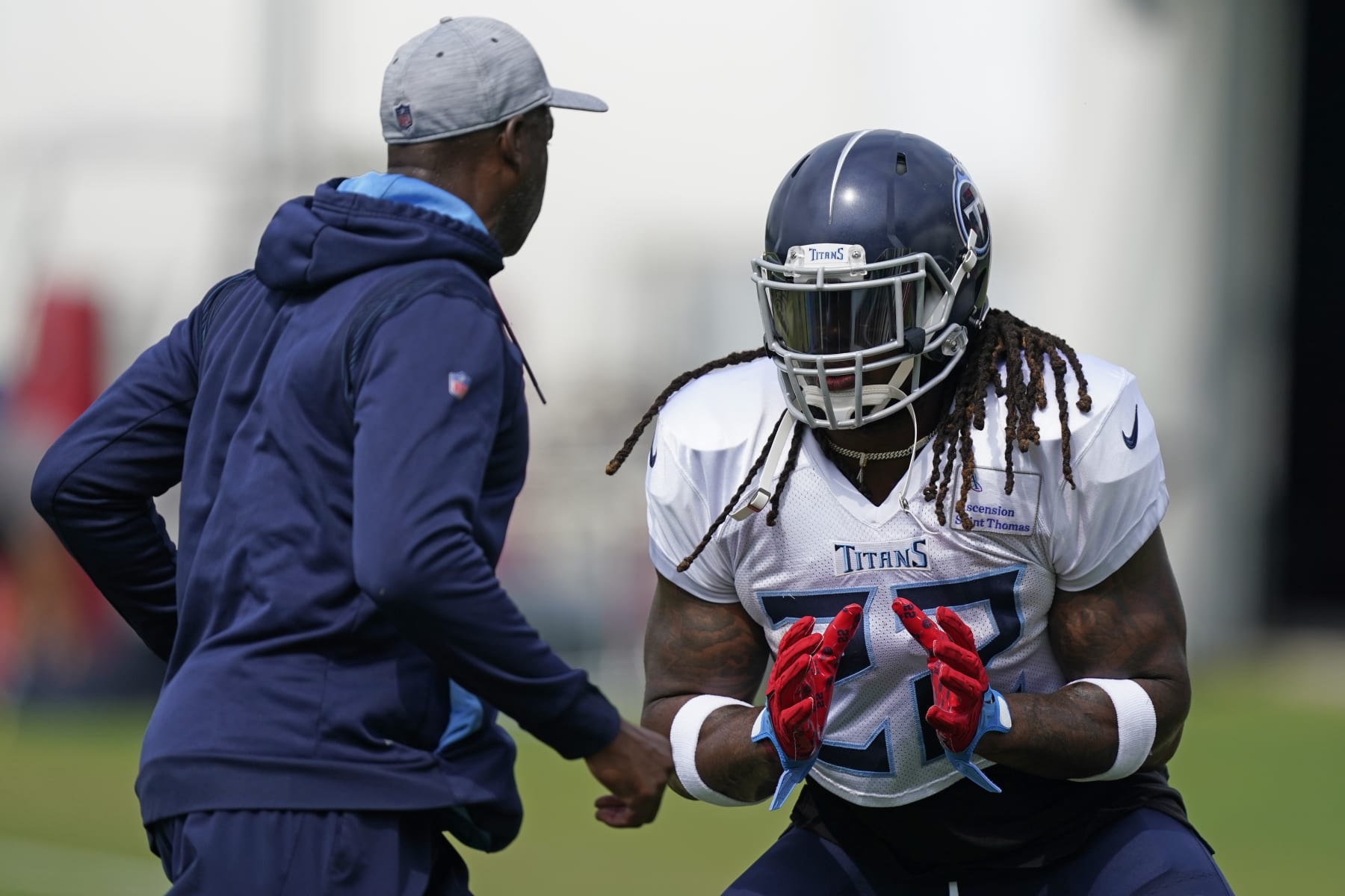 Tennessee Titans running back Derrick Henry (22) takes part in drills during training camp at the NFL football team's practice facility Monday, Aug. 1, 2022, in Nashville, Tenn. (AP Photo/Mark Humphrey)