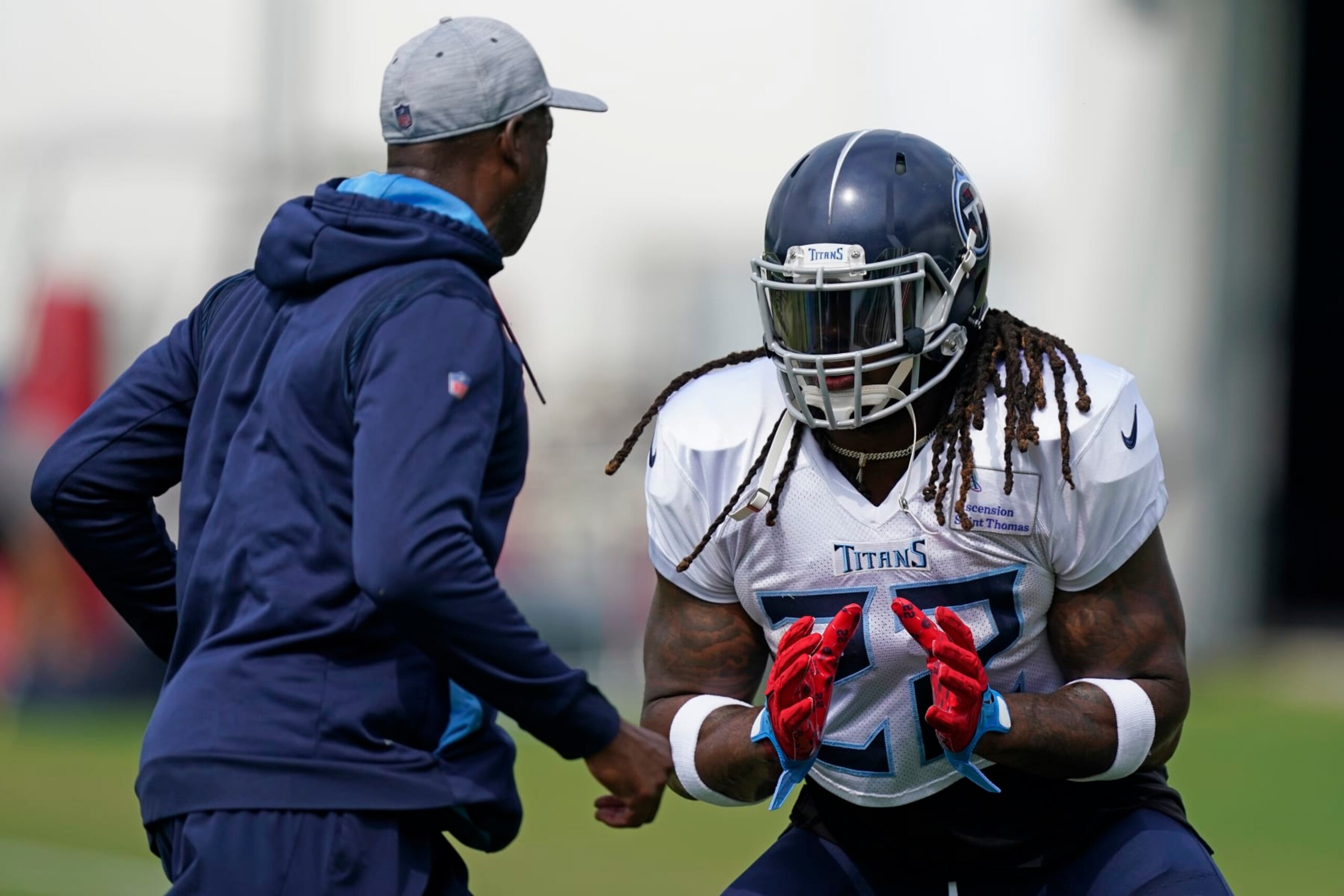 Tennessee Titans running back Derrick Henry (22) takes part in drills during training camp at the NFL football team's practice facility Monday, Aug. 1, 2022, in Nashville, Tenn. (AP Photo/Mark Humphrey)
