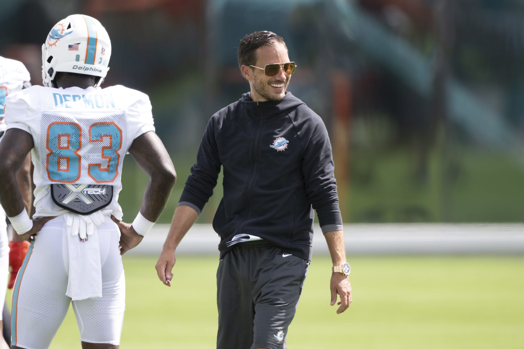 MIAMI GARDENS, FL - AUGUST 06: Miami Dolphins head coach Mike McDaniel smiles during a practice session at the Miami Dolphins training camp at Baptist Health Training Complex on August 6, 2022 in Miami Gardens, Florida. (Photo by Doug Murray/Icon Sportswire via Getty Images)