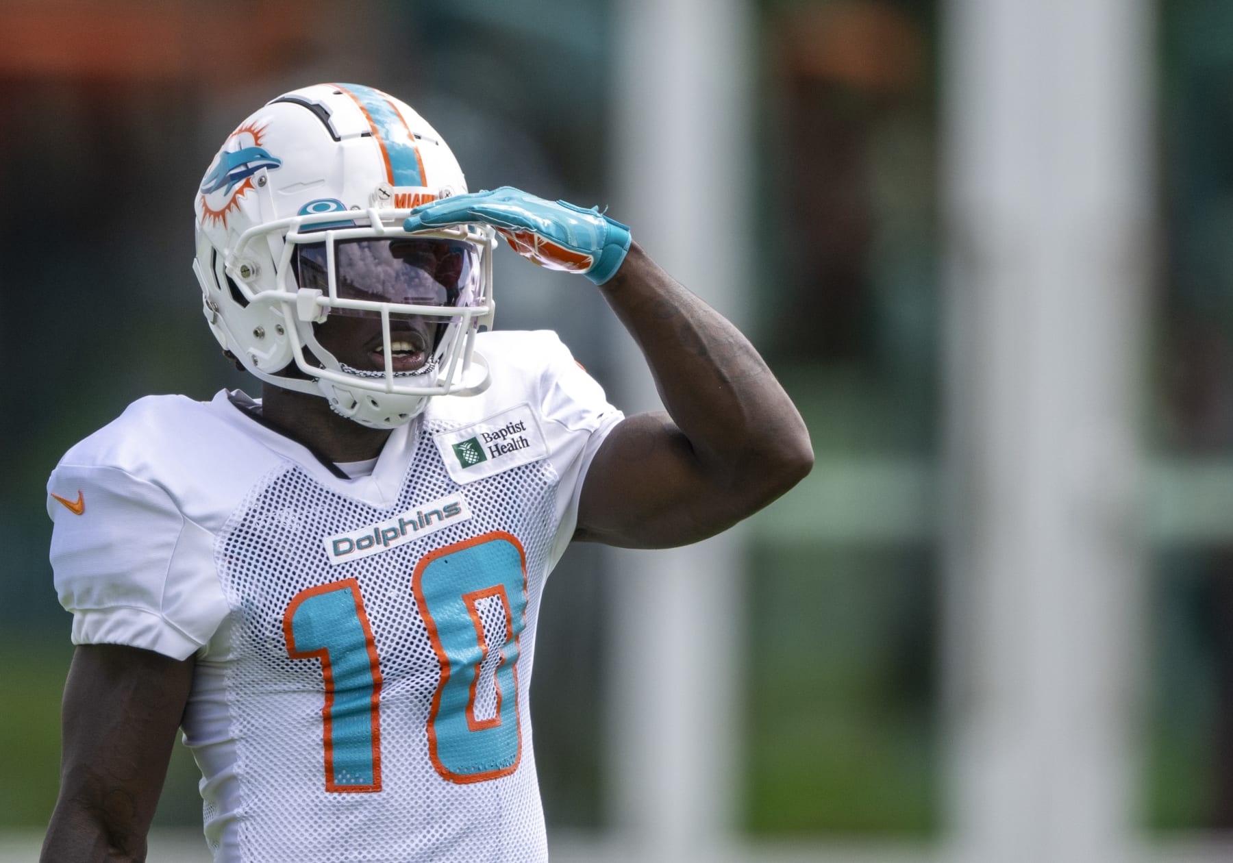 MIAMI GARDENS, FL - AUGUST 06: Miami Dolphins wide receiver Tyreek Hill (10) shades his eye on the field during a practice session at the Miami Dolphins training camp at Baptist Health Training Complex on August 6, 2022 in Miami Gardens, Florida. (Photo by Doug Murray/Icon Sportswire via Getty Images)
