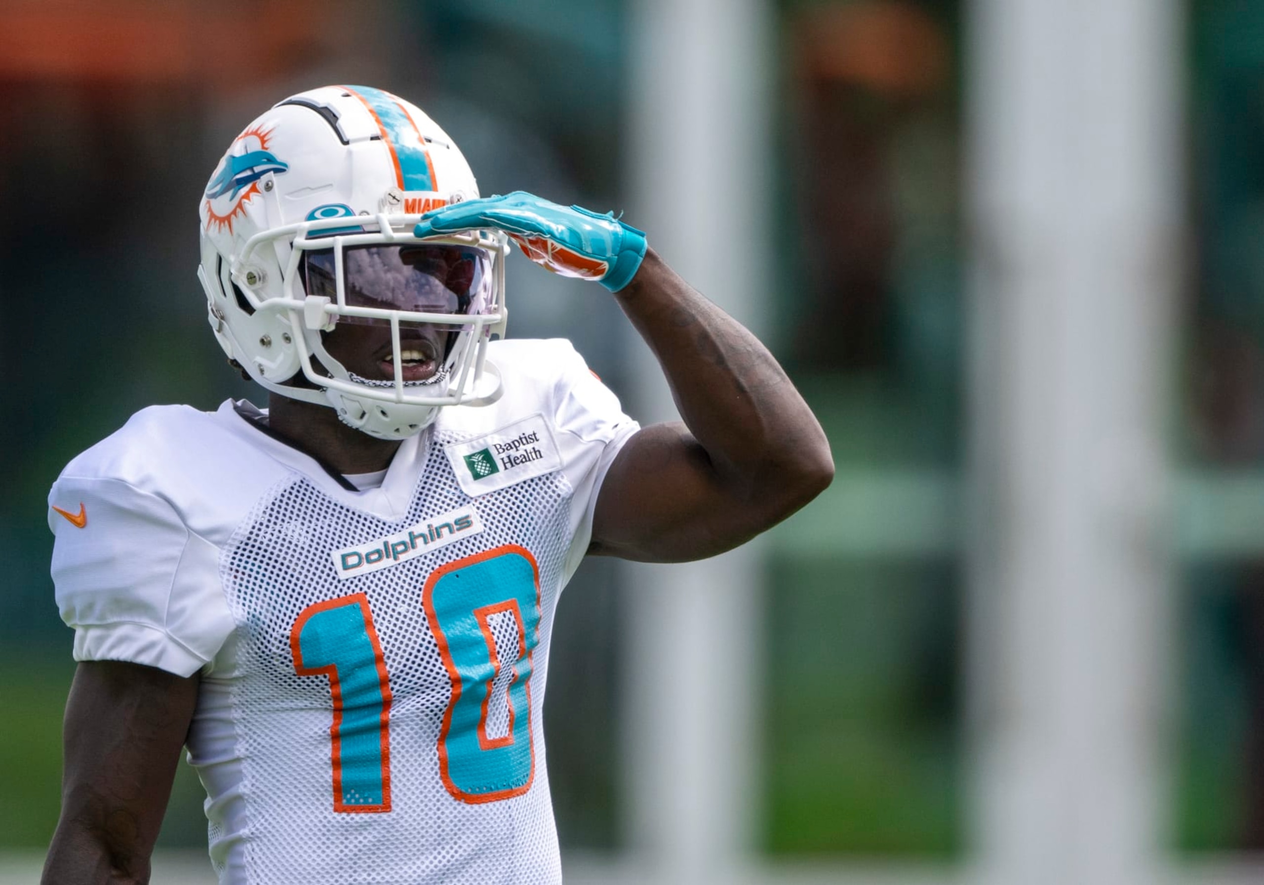 MIAMI GARDENS, FL - AUGUST 06: Miami Dolphins wide receiver Tyreek Hill (10) shades his eye on the field during a practice session at the Miami Dolphins training camp at Baptist Health Training Complex on August 6, 2022 in Miami Gardens, Florida. (Photo by Doug Murray/Icon Sportswire via Getty Images)