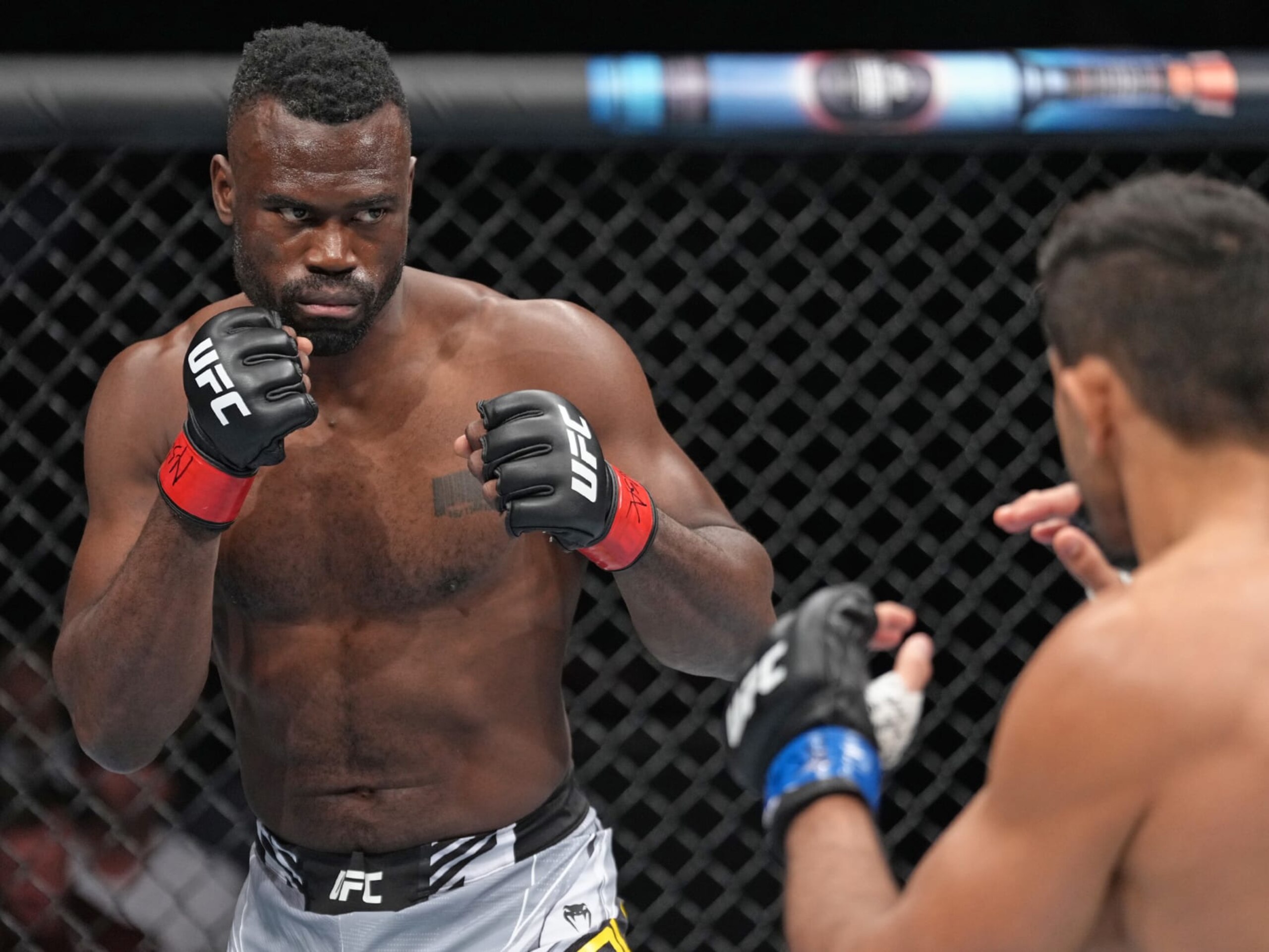 LAS VEGAS, NEVADA - JULY 02: (L-R) Uriah Hall of Jamaica faces Andre Muniz of Brazil in a middleweight fight during the UFC 276 event at T-Mobile Arena on July 02, 2022 in Las Vegas, Nevada. (Photo by Jeff Bottari/Zuffa LLC)