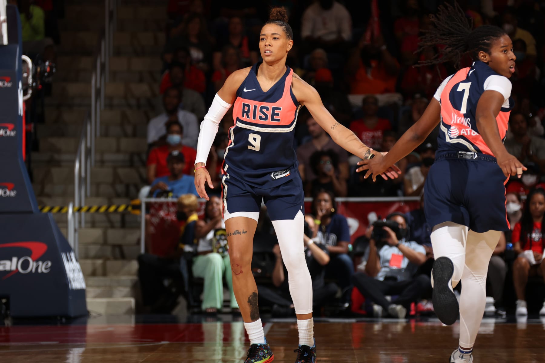 WASHINGTON, DC - AUGUST 2: Natasha Cloud #9 of the Washington Mystics high fives Ariel Atkins #7 during the game against the Las Vegas Aces on August 2, 2022 at Entertainment & Sports Arena in Washington, DC. NOTE TO USER: User expressly acknowledges and agrees that, by downloading and or using this Photograph, user is consenting to the terms and conditions of the Getty Images License Agreement. Mandatory Copyright Notice: Copyright 2022 NBAE (Photo by Stephen Gosling/NBAE via Getty Images)