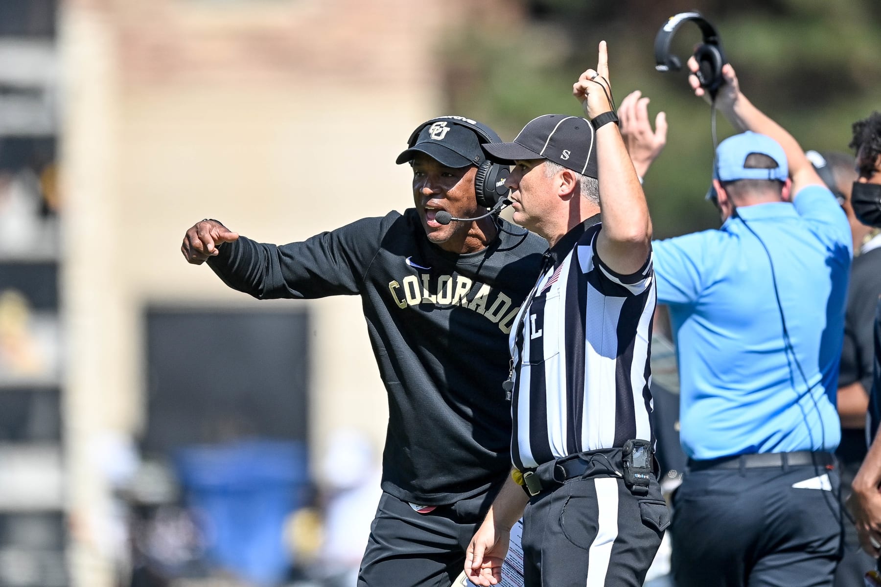 BOULDER, CO - OCTOBER 2:  Head coach Karl Dorrell of the Colorado Buffaloes talks to a referee in the first quarter of a game against the USC Trojans at Folsom Field on October 2, 2021 in Boulder, Colorado.  (Photo by Dustin Bradford/Getty Images)