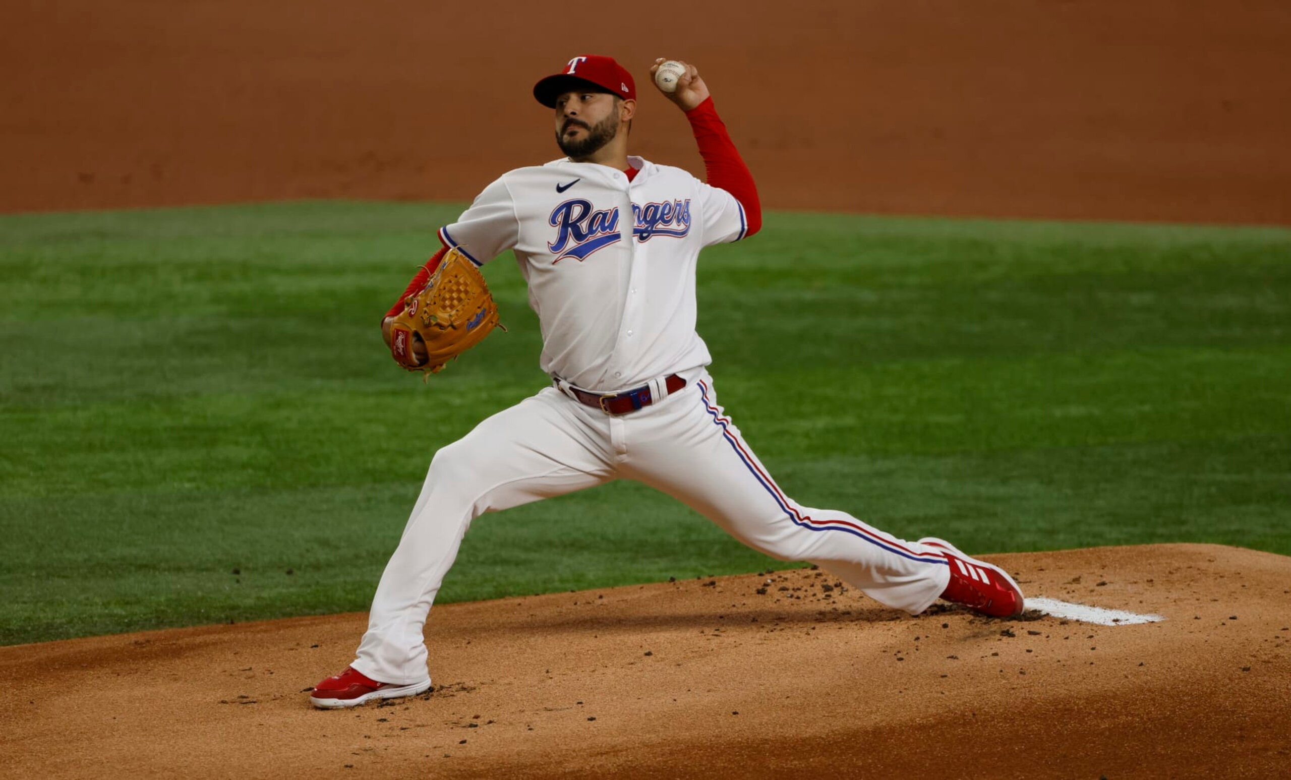ARLINGTON, TX - AUGUST 3: Martin Perez #54 of the Texas Rangers pitches against the Baltimore Orioles during the first inning at Globe Life Field on August 3, 2022 in Arlington, Texas. (Photo by Ron Jenkins/Getty Images)