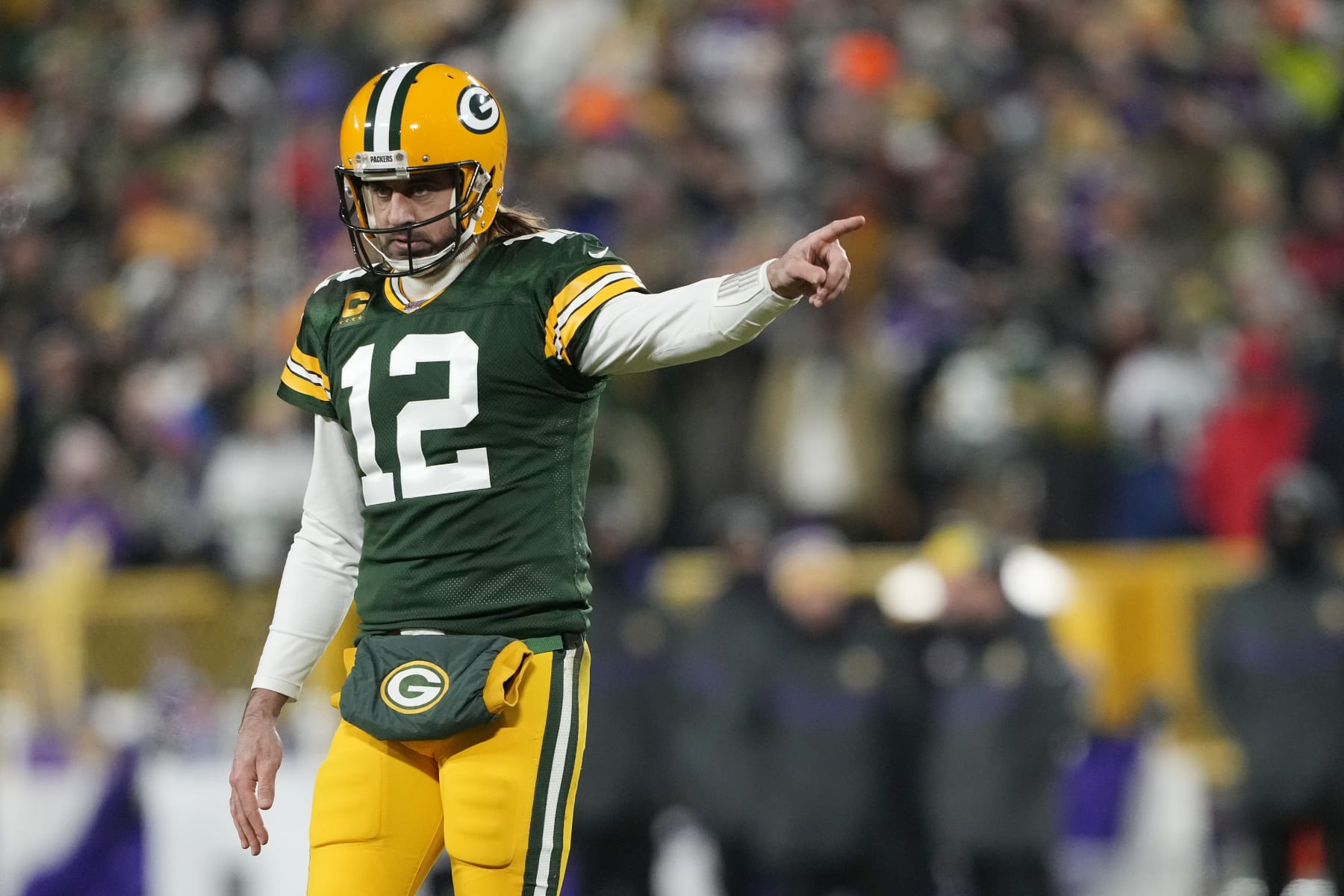 GREEN BAY, WISCONSIN - JANUARY 02: Aaron Rodgers #12 of the Green Bay Packers reacts after a play against the Minnesota Vikings in the second half at Lambeau Field on January 02, 2022 in Green Bay, Wisconsin. (Photo by Patrick McDermott/Getty Images)