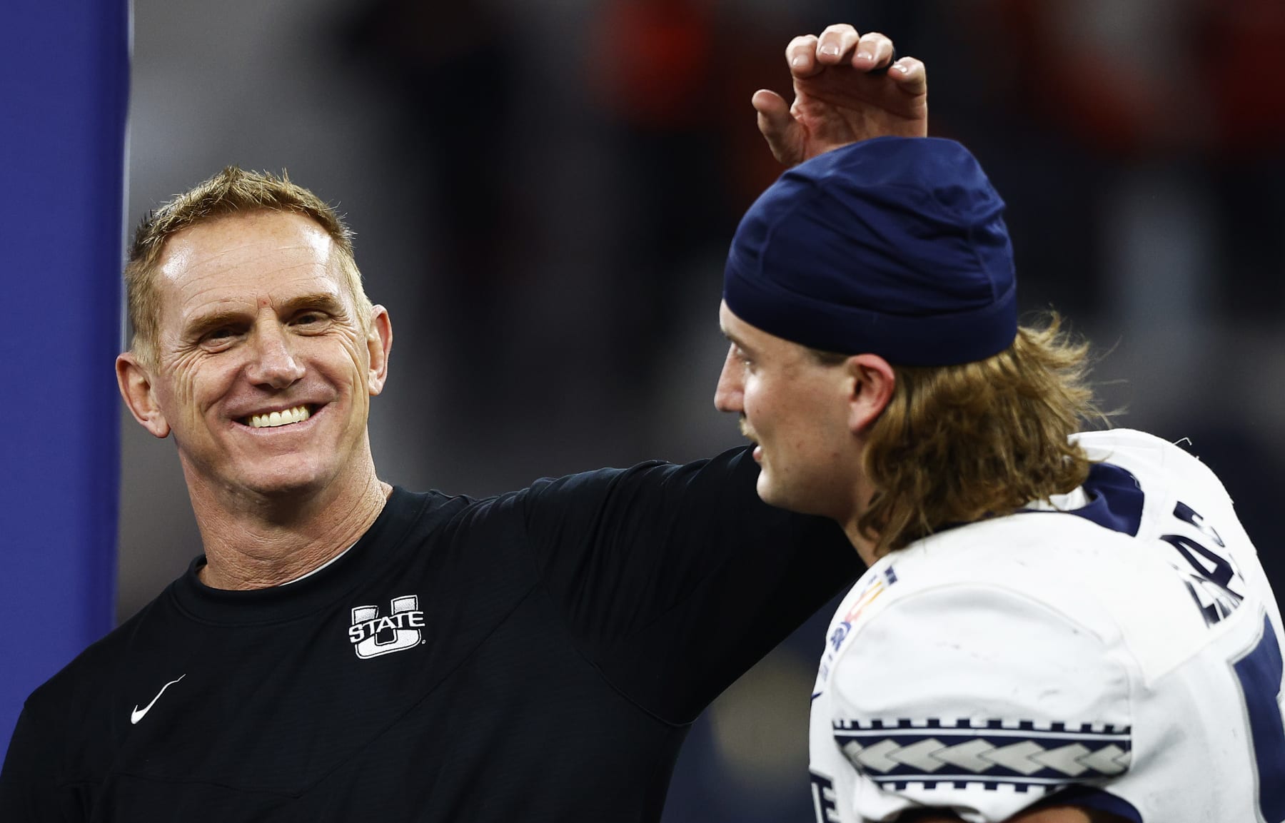INGLEWOOD, CALIFORNIA - DECEMBER 18: Head Coach Blake Anderson of the Utah State Aggies congratulates teammate Cooper Legas #5 after the game against the Oregon State Beavers of the Jimmy Kimmel LA BOWL Presented by Stifel at SoFi Stadium on December 18, 2021 in Inglewood, California. (Photo by Ronald Martinez/Getty Images)