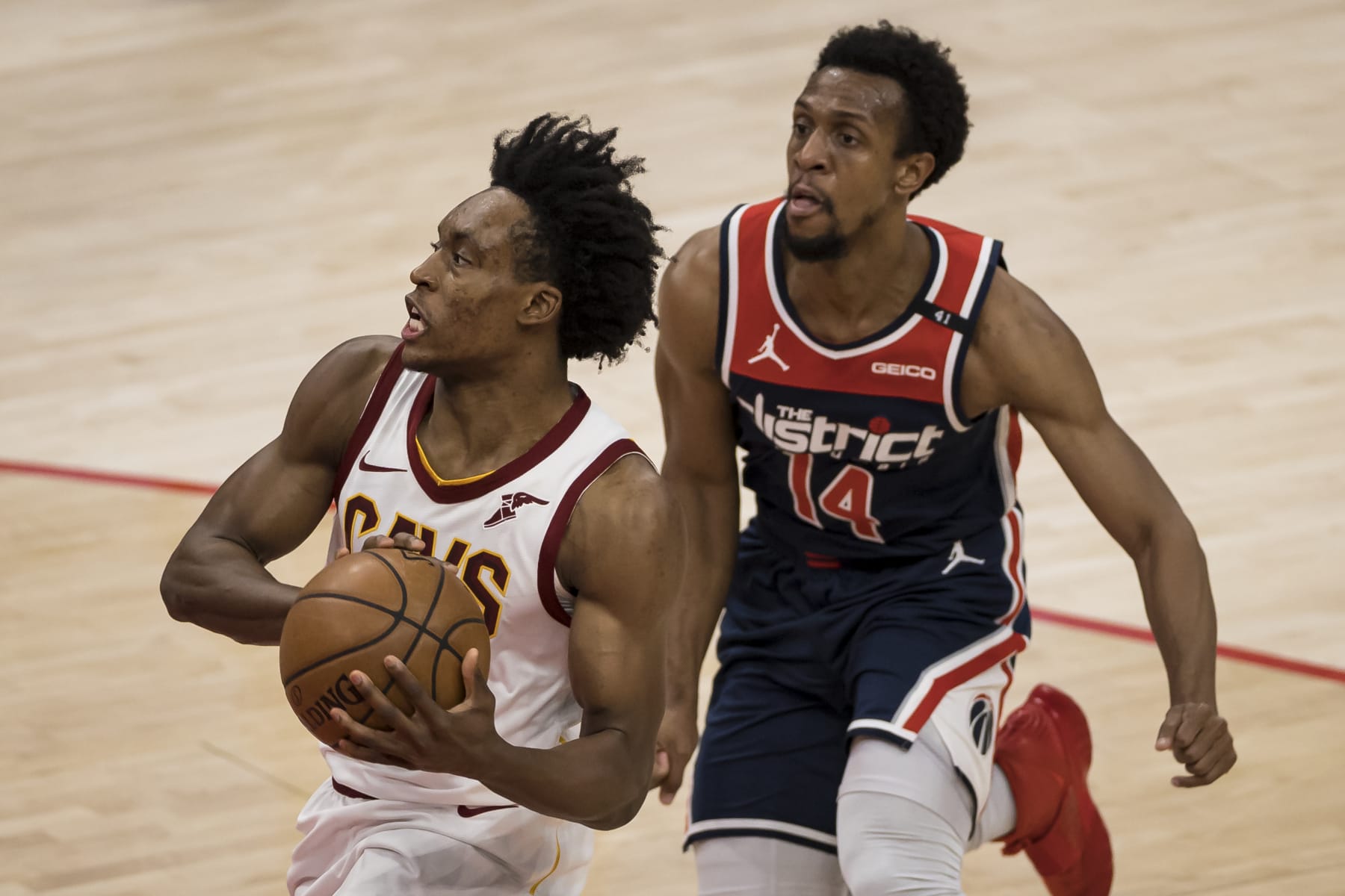 WASHINGTON, DC - MAY 14: Collin Sexton #2 of the Cleveland Cavaliers goes to the basket in front of Ish Smith #14 of the Washington Wizards during the second half at Capital One Arena on May 14, 2021 in Washington, DC. NOTE TO USER: User expressly acknowledges and agrees that, by downloading and or using this photograph, User is consenting to the terms and conditions of the Getty Images License Agreement. (Photo by Scott Taetsch/Getty Images)