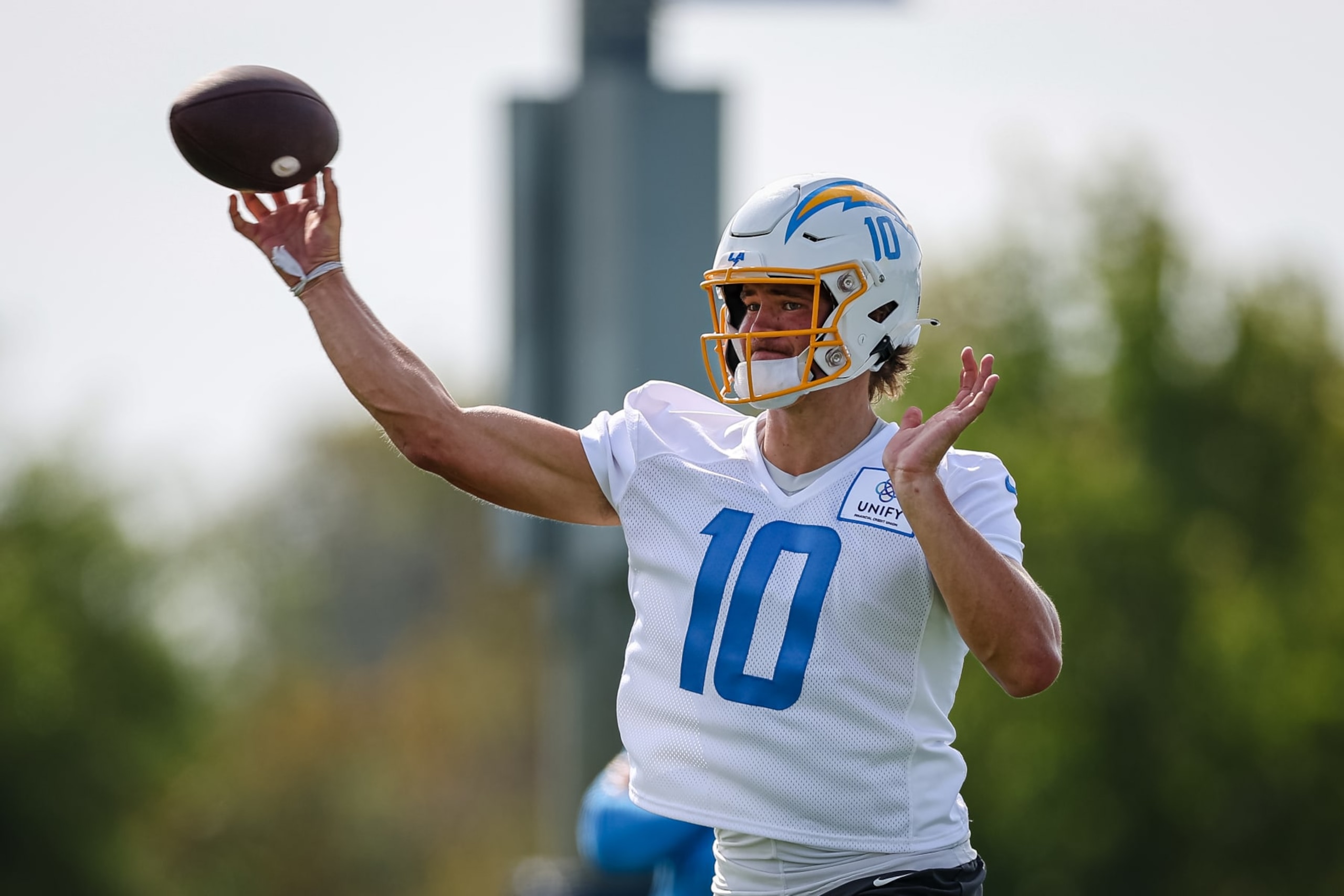 COSTA MESA, CA - JULY 27: Justin Herbert #10 of the Los Angeles Chargers attempts a pass during training camp at Jack Hammett Sports Complex on July 27, 2022 in Costa Mesa, California. (Photo by Scott Taetsch/Getty Images)
