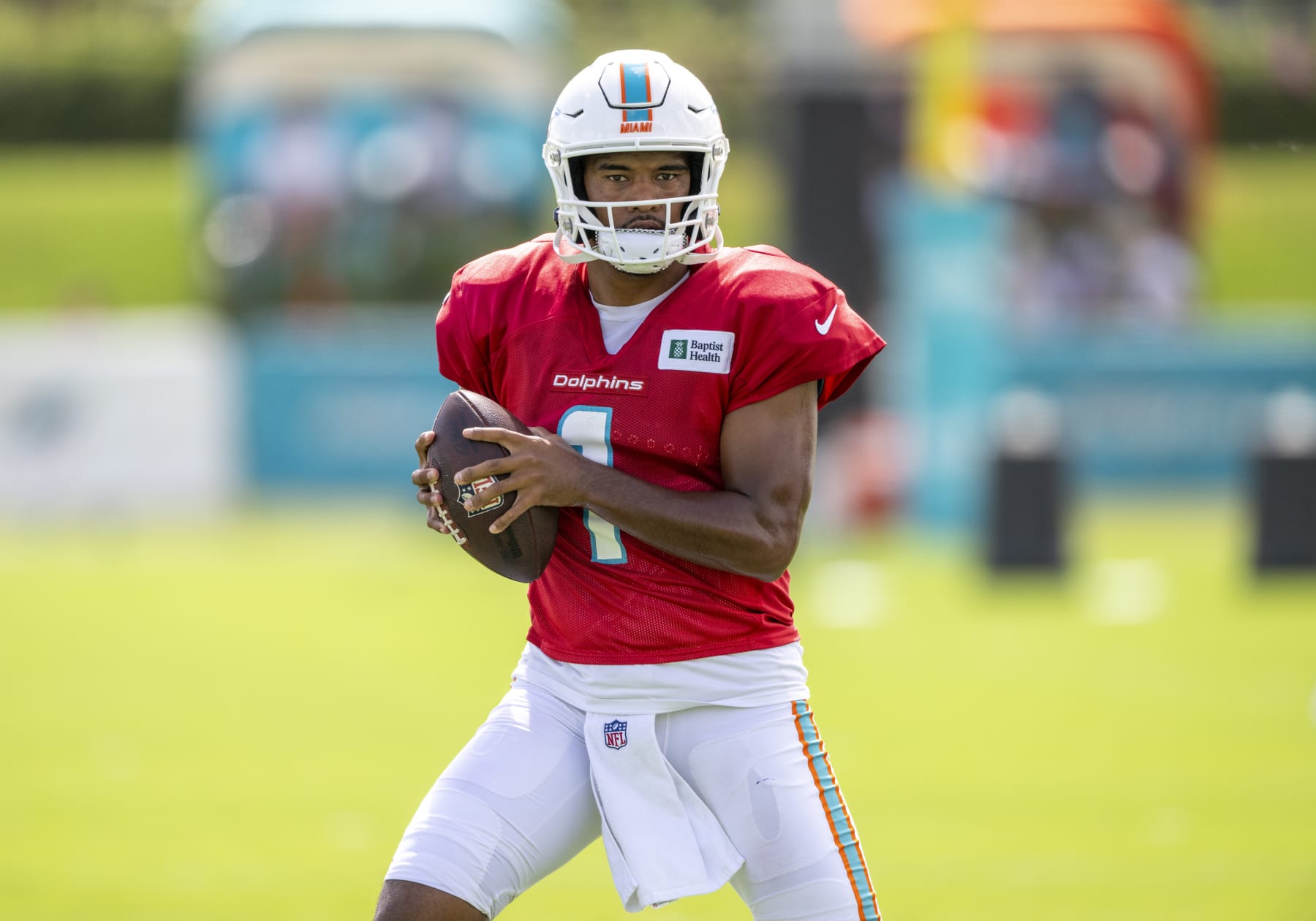 MIAMI GARDENS, FL - AUGUST 06: Miami Dolphins quarterback Tua Tagovailoa (1) warms up on the field during a practice session at the Miami Dolphins training camp at Baptist Health Training Complex on August 6, 2022 in Miami Gardens, Florida. (Photo by Doug Murray/Icon Sportswire via Getty Images)