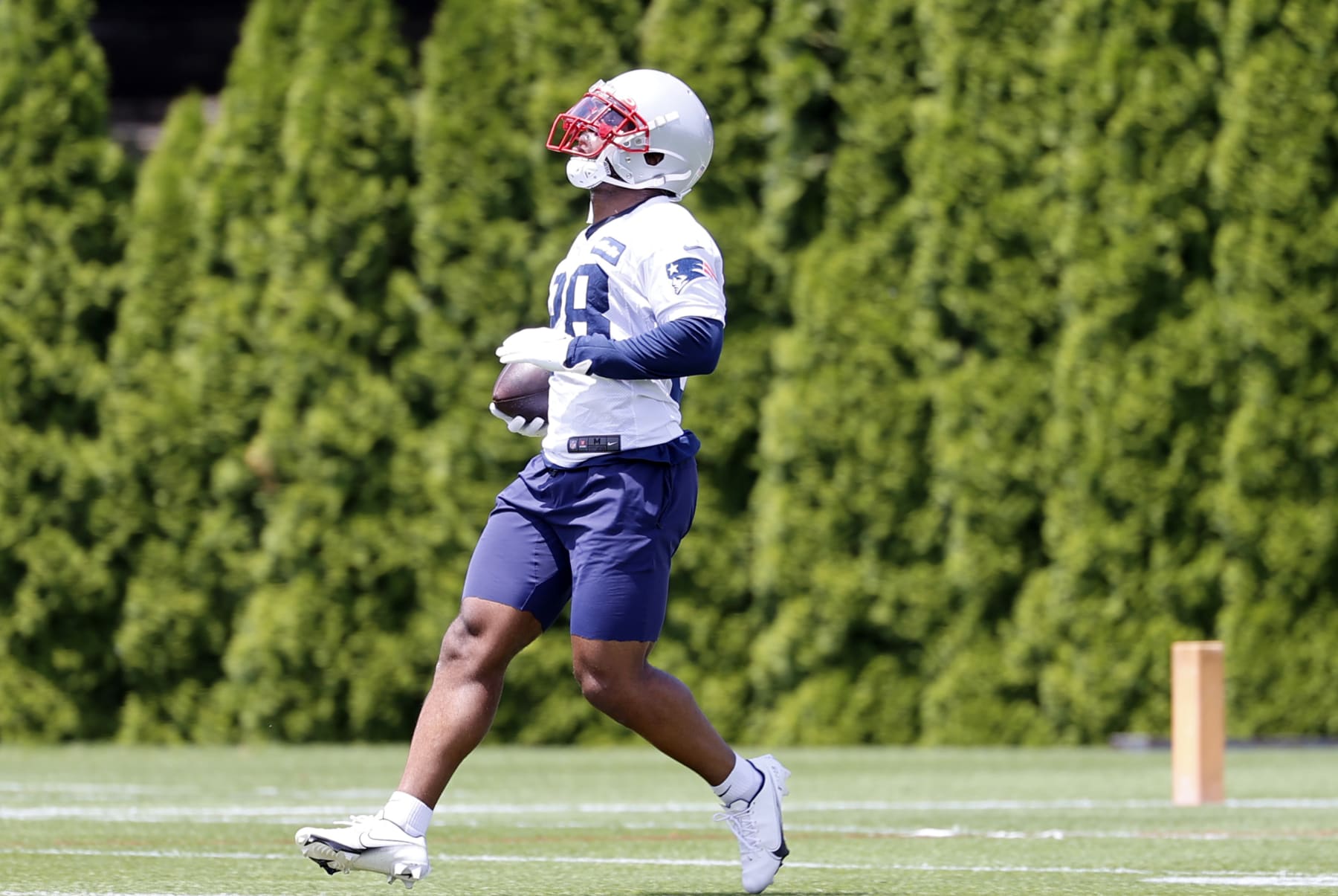 FOXBOROUGH, MA - JUNE 07: New England Patriots running back James White (28) carries the ball during Day 1 of New England Patriots minicamp on June 7, 2022 at the Patriots Training Facility at Gillette Stadium in Foxborough, Massachusetts. (Photo by Fred Kfoury III/Icon Sportswire via Getty Images)