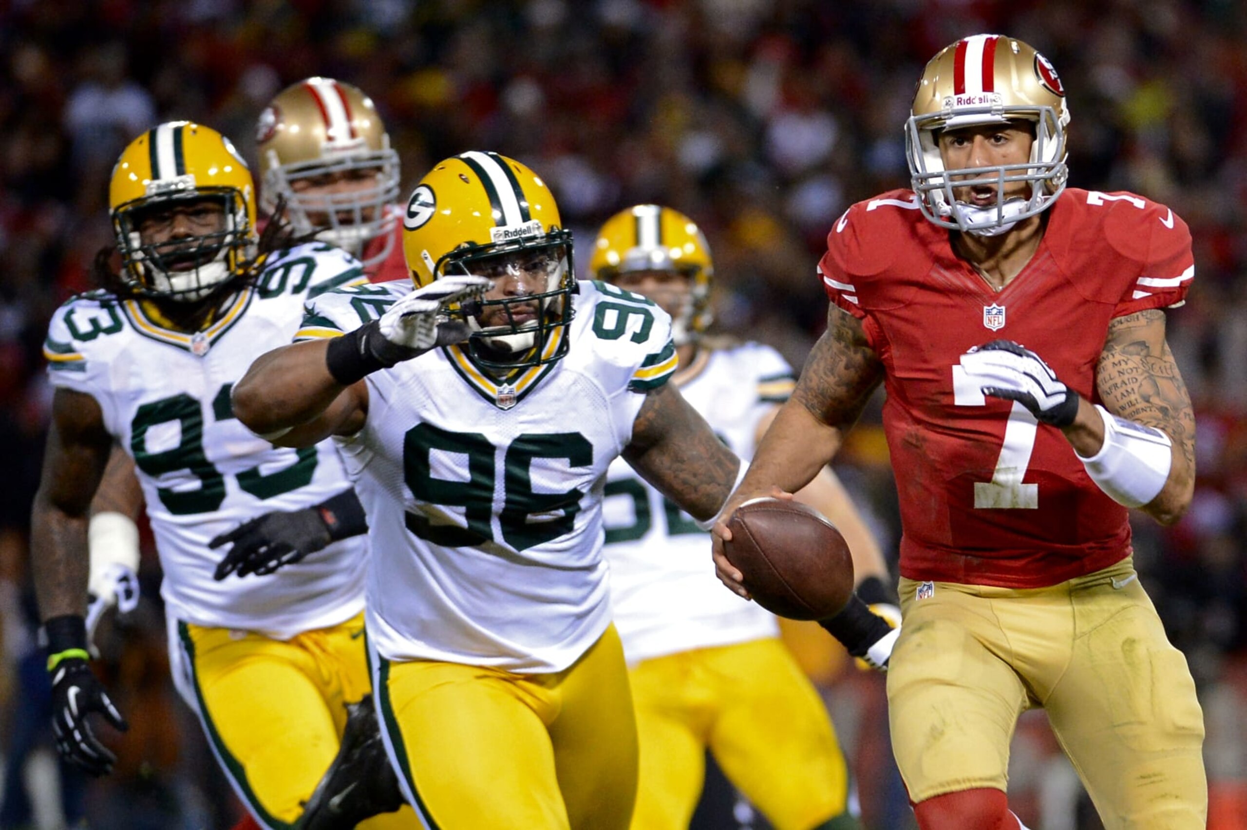 SAN FRANCISCO, CA - JANUARY 12:  Quarterback Colin Kaepernick #7 of the San Francisco 49ers in actions against the Green Bay Packers during the NFC Divisional Playoff Game at Candlestick Park on January 12, 2013 in San Francisco, California.  (Photo by Harry How/Getty Images) 