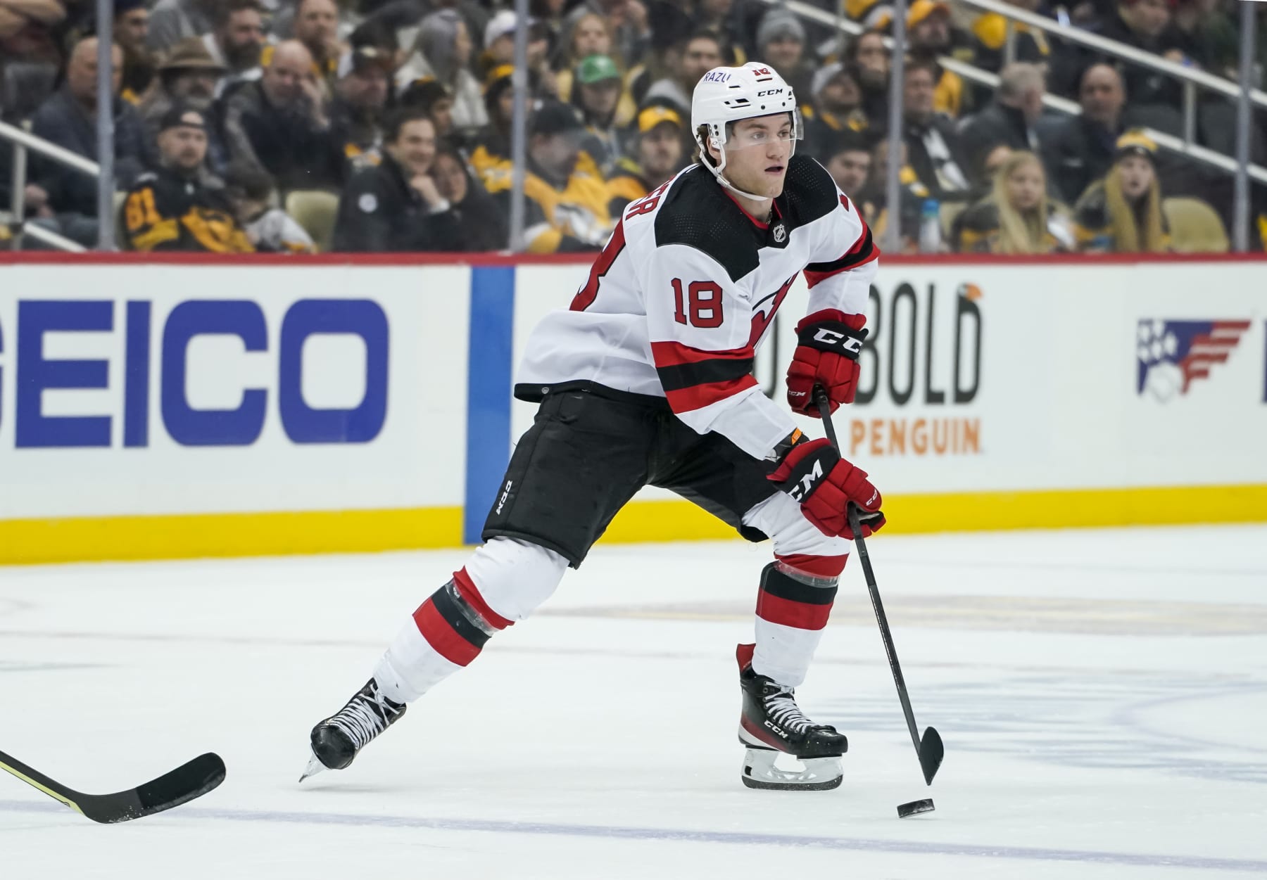 PITTSBURGH, PA - FEBRUARY 24: New Jersey Devils Right Wing Dawson Mercer (18) skates with the puck during the second period in the NHL game between the Pittsburgh Penguins and the New Jersey Devils  on February 24, 2022, at PPG Paints Arena in Pittsburgh, PA. (Photo by Jeanine Leech/Icon Sportswire via Getty Images)