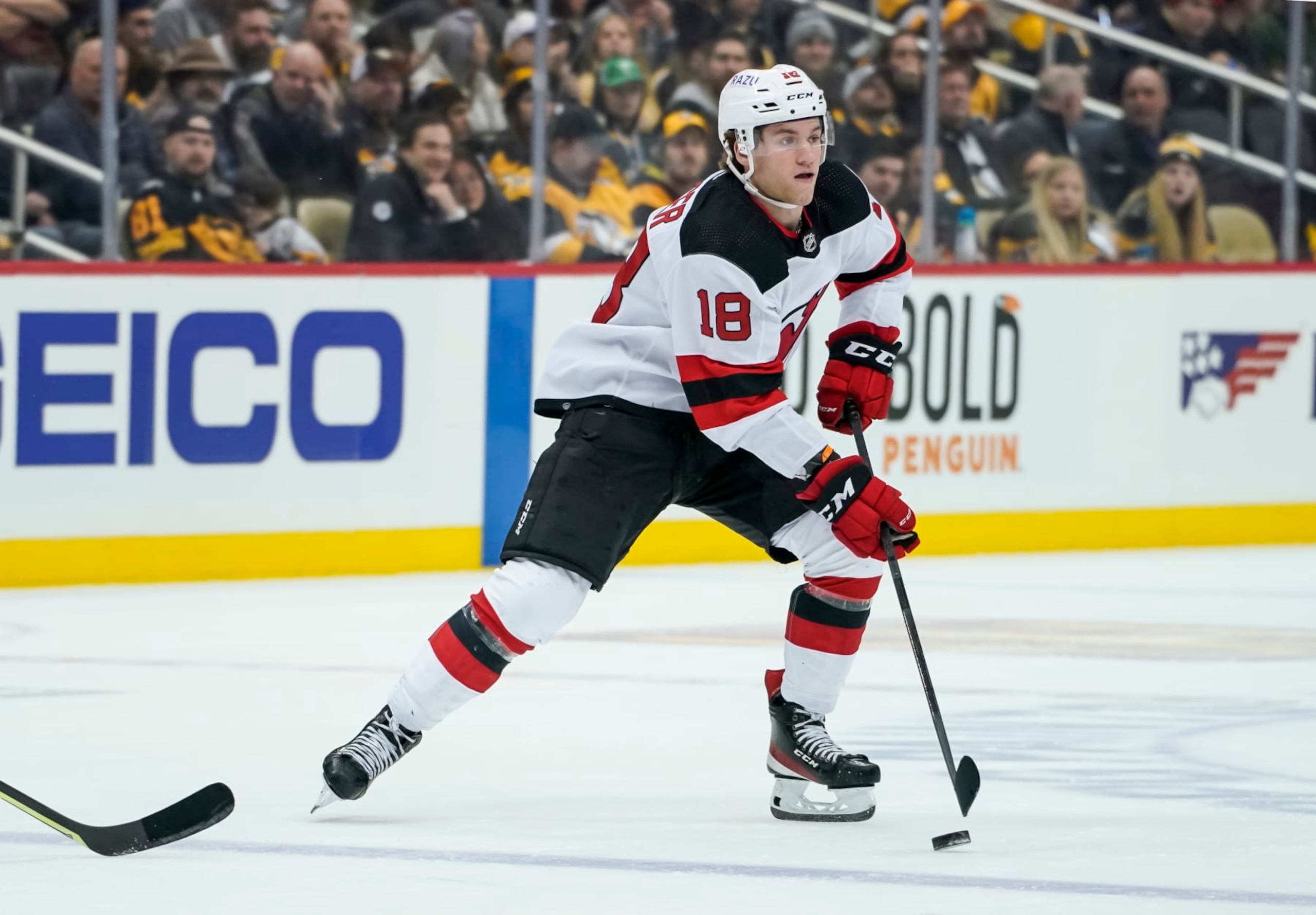 PITTSBURGH, PA - FEBRUARY 24: New Jersey Devils Right Wing Dawson Mercer (18) skates with the puck during the second period in the NHL game between the Pittsburgh Penguins and the New Jersey Devils  on February 24, 2022, at PPG Paints Arena in Pittsburgh, PA. (Photo by Jeanine Leech/Icon Sportswire via Getty Images)