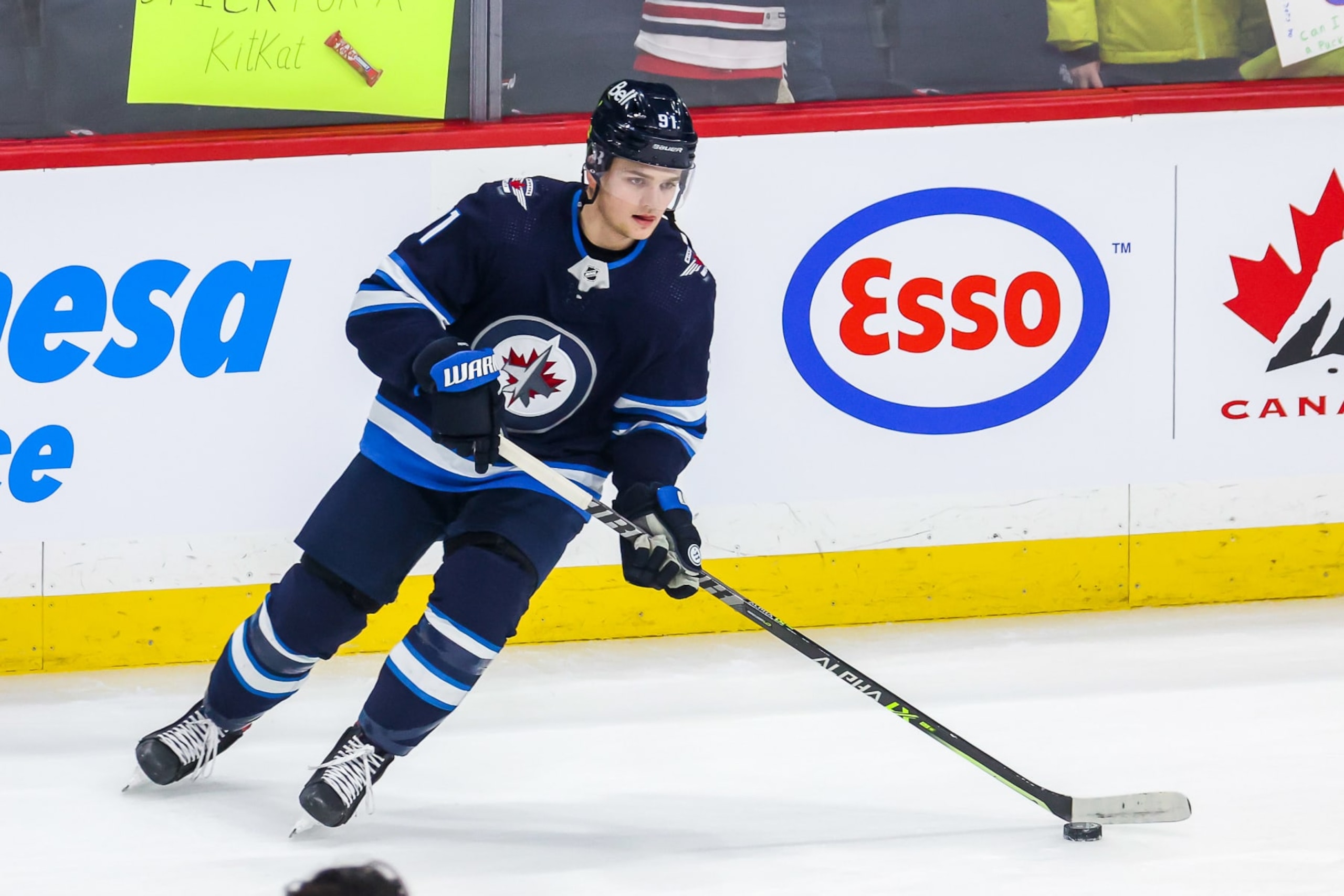 WINNIPEG, MB - FEBRUARY 16: Cole Perfetti #91 of the Winnipeg Jets takes part in the pre-game warm up prior to NHL action against the Minnesota Wild at the Canada Life Centre on February 16, 2022 in Winnipeg, Manitoba, Canada. (Photo by Jonathan Kozub/NHLI via Getty Images)