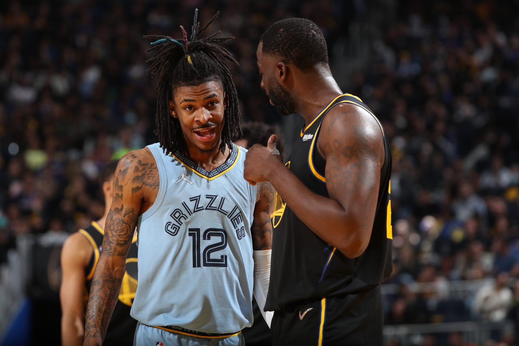 SAN FRANCISCO, CA - MAY 7: Ja Morant #12 of the Memphis Grizzlies talks with Draymond Green #23 of the Golden State Warriors during Game 3 of the 2022 NBA Playoffs Western Conference Semifinals on May 7, 2022 at Chase Center in San Francisco, California. NOTE TO USER: User expressly acknowledges and agrees that, by downloading and or using this photograph, user is consenting to the terms and conditions of Getty Images License Agreement. Mandatory Copyright Notice: Copyright 2022 NBAE (Photo by Joe Murphy/NBAE via Getty Images)