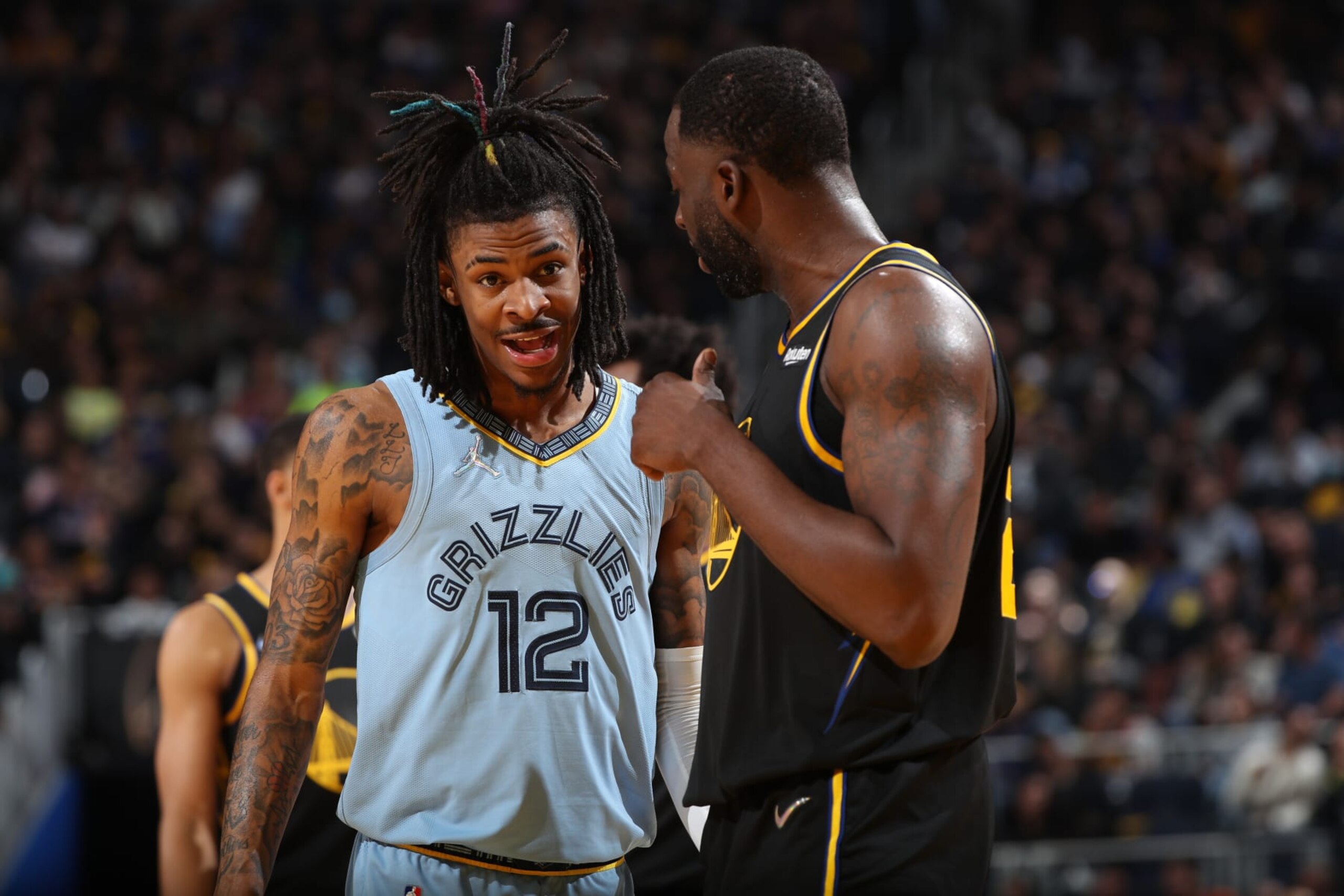 SAN FRANCISCO, CA - MAY 7: Ja Morant #12 of the Memphis Grizzlies talks with Draymond Green #23 of the Golden State Warriors during Game 3 of the 2022 NBA Playoffs Western Conference Semifinals on May 7, 2022 at Chase Center in San Francisco, California. NOTE TO USER: User expressly acknowledges and agrees that, by downloading and or using this photograph, user is consenting to the terms and conditions of Getty Images License Agreement. Mandatory Copyright Notice: Copyright 2022 NBAE (Photo by Joe Murphy/NBAE via Getty Images)