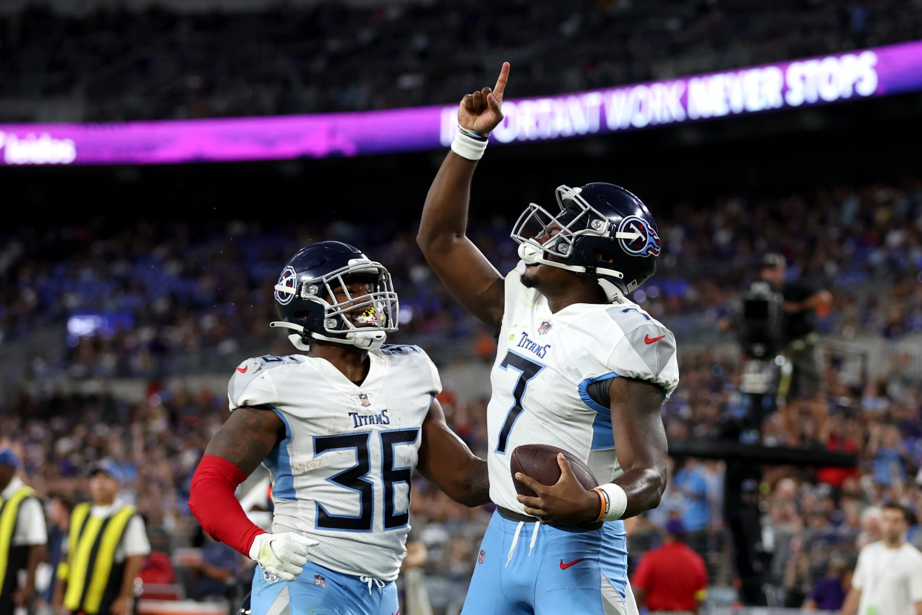 BALTIMORE, MARYLAND - AUGUST 11: Malik Willis #7 of the Tennessee Titans celebrates with Julius Chestnut #36 after rushing for a second quarter touchdown against the Baltimore Ravens at M&T Bank Stadium on August 11, 2022 in Baltimore, Maryland. (Photo by Rob Carr/Getty Images)