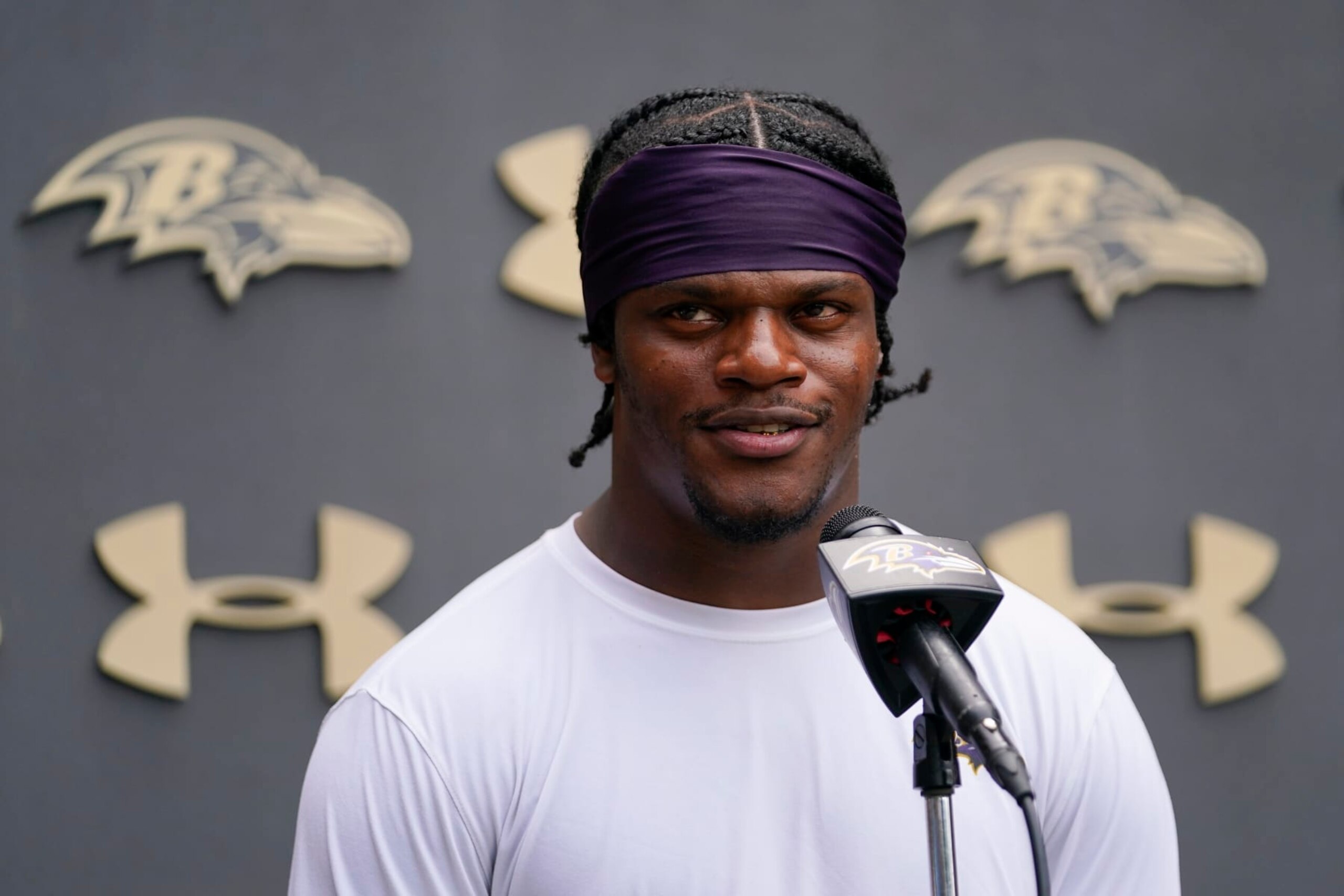 Baltimore Ravens quarterback Lamar Jackson talks to reporters during the team's NFL football training camp, Thursday, July 28, 2022, in Owings Mills, Md. (AP Photo/Julio Cortez)