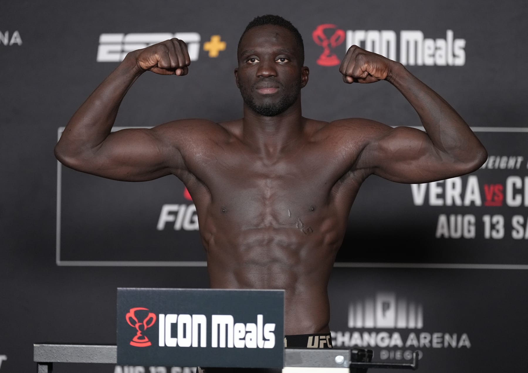 LAS VEGAS, NEVADA - AUGUST 12: David Onama of Uganda poses on the scale during the UFC Fight Night official weigh-in at the Sheraton San Diego Hotel and Marina on August 12, 2022 in San Diego, California. (Photo by Jeff Bottari/Zuffa LLC)